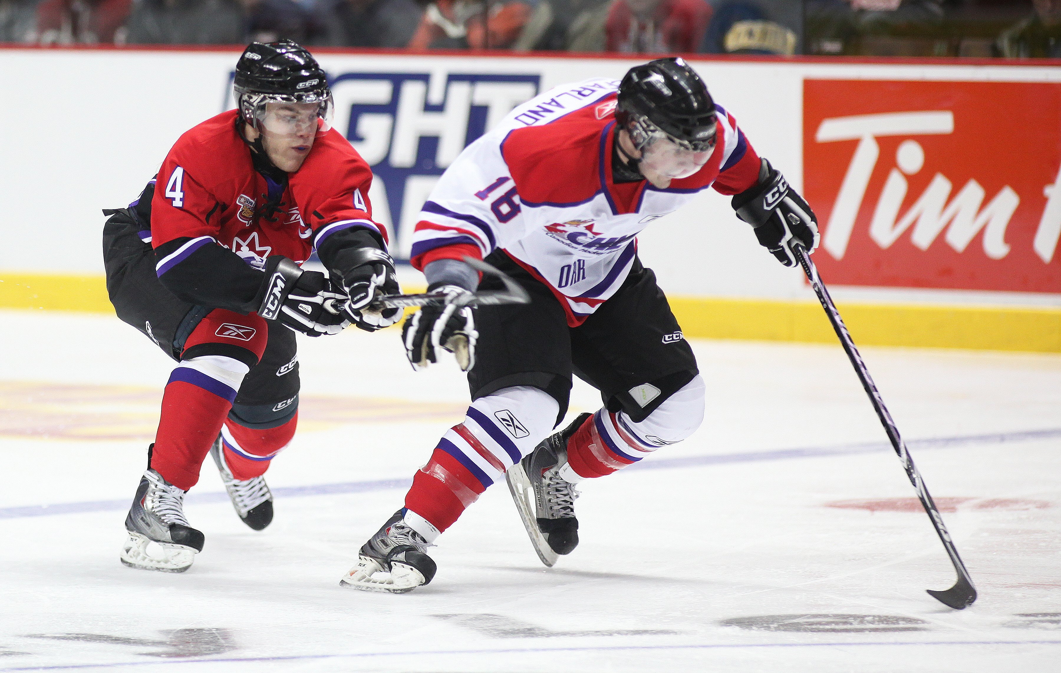 WINDSOR, ON - JANUARY 20:  Taylor Hall #4 of Team Cherry tries to stick check John McFarland #18 of Team Orr during the Home Hardware CHL/NHL Top Prospects game on January 20, 2010 at the WFCU Centre in Windsor, Ontario. Team Cherry defeated Team Orr 4-2.