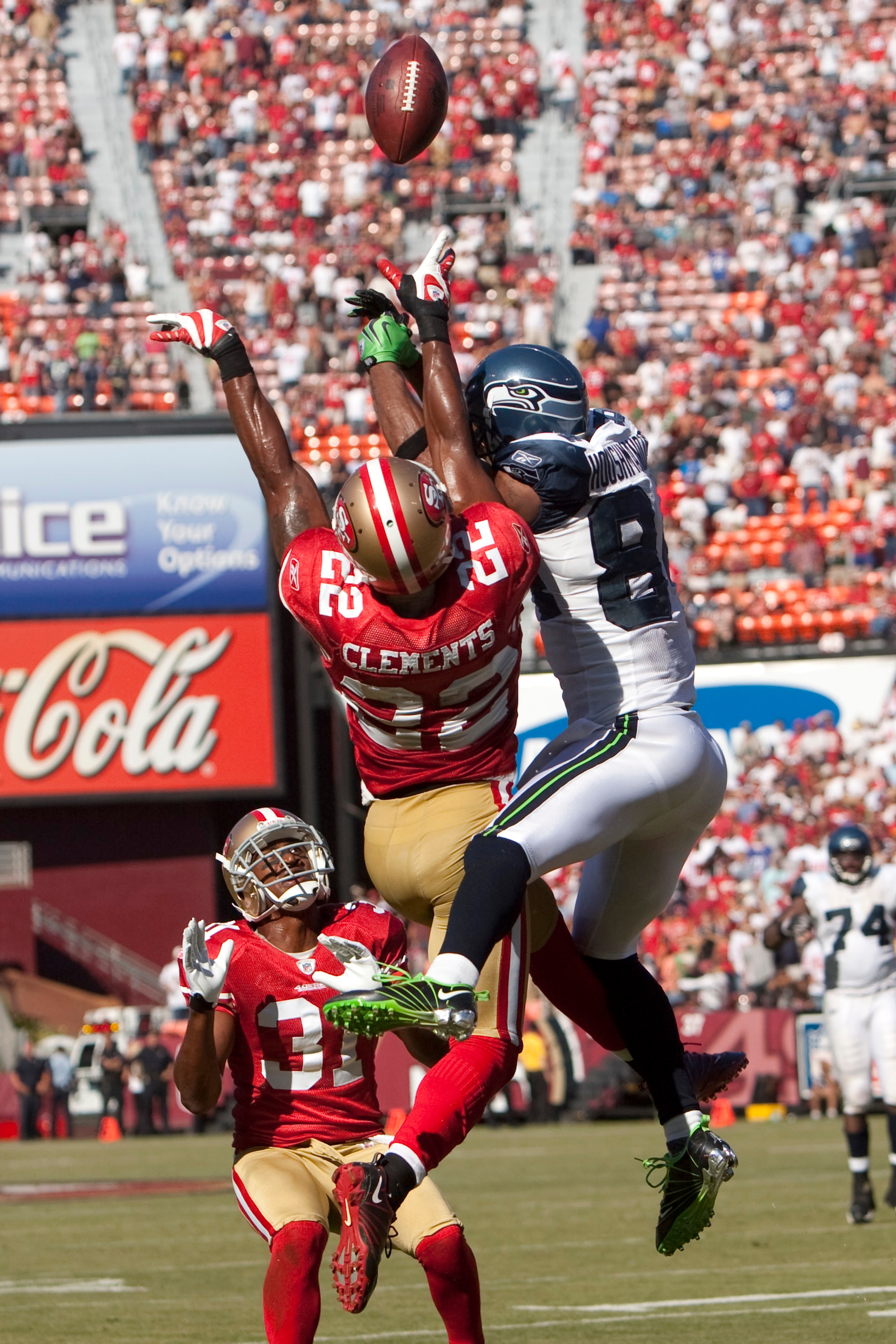 SAN FRANCISCO - SEPTEMBER 20:  Nate Clements #22 of the San Francisco 49ers goes up against T.J. Houshmandzadeh #84 for a pass as Dre' Bly #31 of the San Francisco 49ers looks on during 4th quarter action during home opener as the San Francisco 49ers host