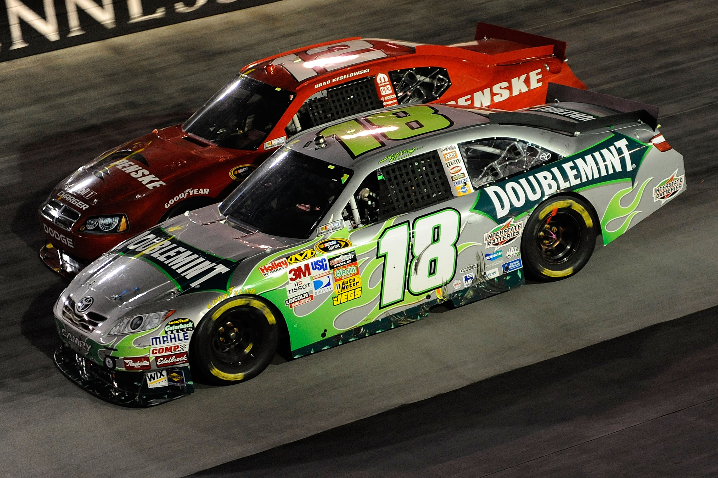 BRISTOL, TN - AUGUST 21:  Kyle Busch, driver of the #18 Doublemint Toyota, and Brad Keselowski, driver of the #12 Penske Dodge, during the NASCAR Sprint Cup Series IRWIN Tools Night Race at Bristol Motor Speedway on August 21, 2010 in Bristol, Tennessee. 