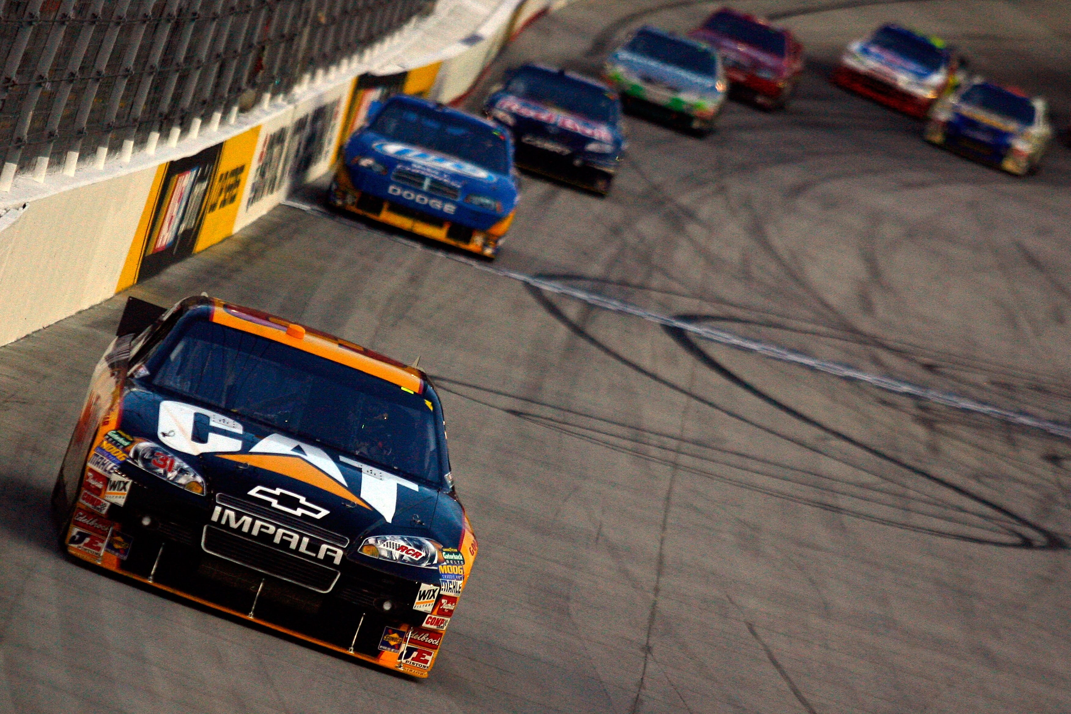 BRISTOL, TN - AUGUST 21:  Jeff Burton, driver of the #31 Caterpilliar Chevrolet, leads the field during the NASCAR Sprint Cup Series IRWIN Tools Night Race at Bristol Motor Speedway on August 21, 2010 in Bristol, Tennessee.  (Photo by Jason Smith/Getty Im