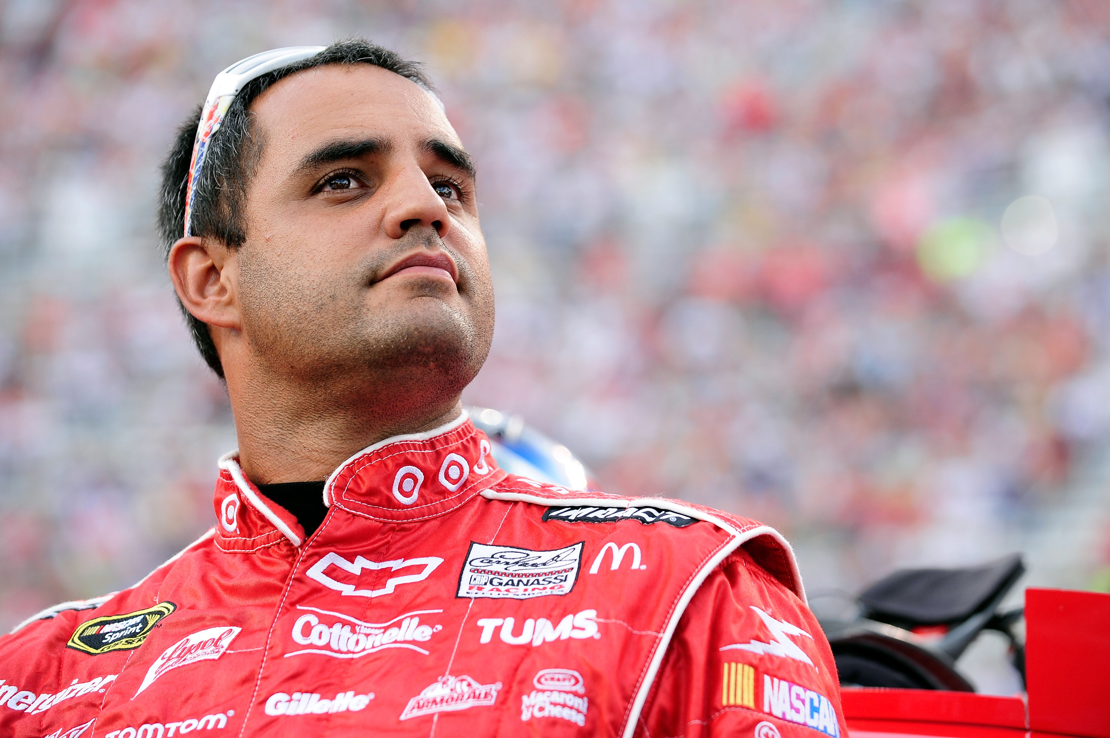 BRISTOL, TN - AUGUST 21:  Juan Pablo Montoya, driver of the #42 Target Chevrolet, stands on the grid prior to the start of the NASCAR Sprint Cup Series IRWIN Tools Night Race at Bristol Motor Speedway on August 21, 2010 in Bristol, Tennessee.  (Photo by J