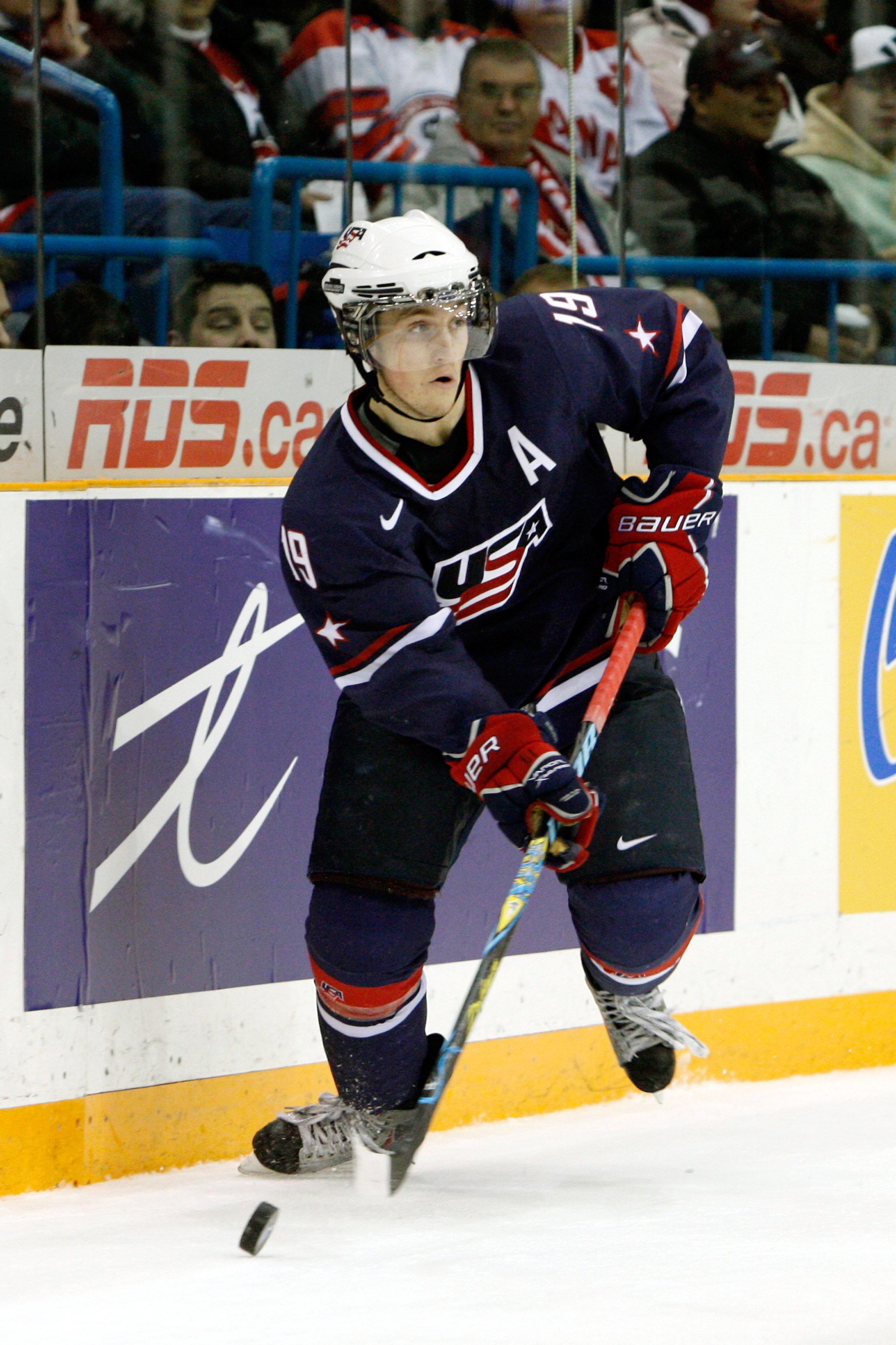 SASKATOON, SK - JANUARY 3:  Jordan Schroeder #19 of Team USA skates with the puck during the 2010 IIHF World Junior Championship Tournament Semifinal game against Team Sweden on January 3, 2010 at the Credit Union Centre in Saskatoon, Saskatchewan, Canada
