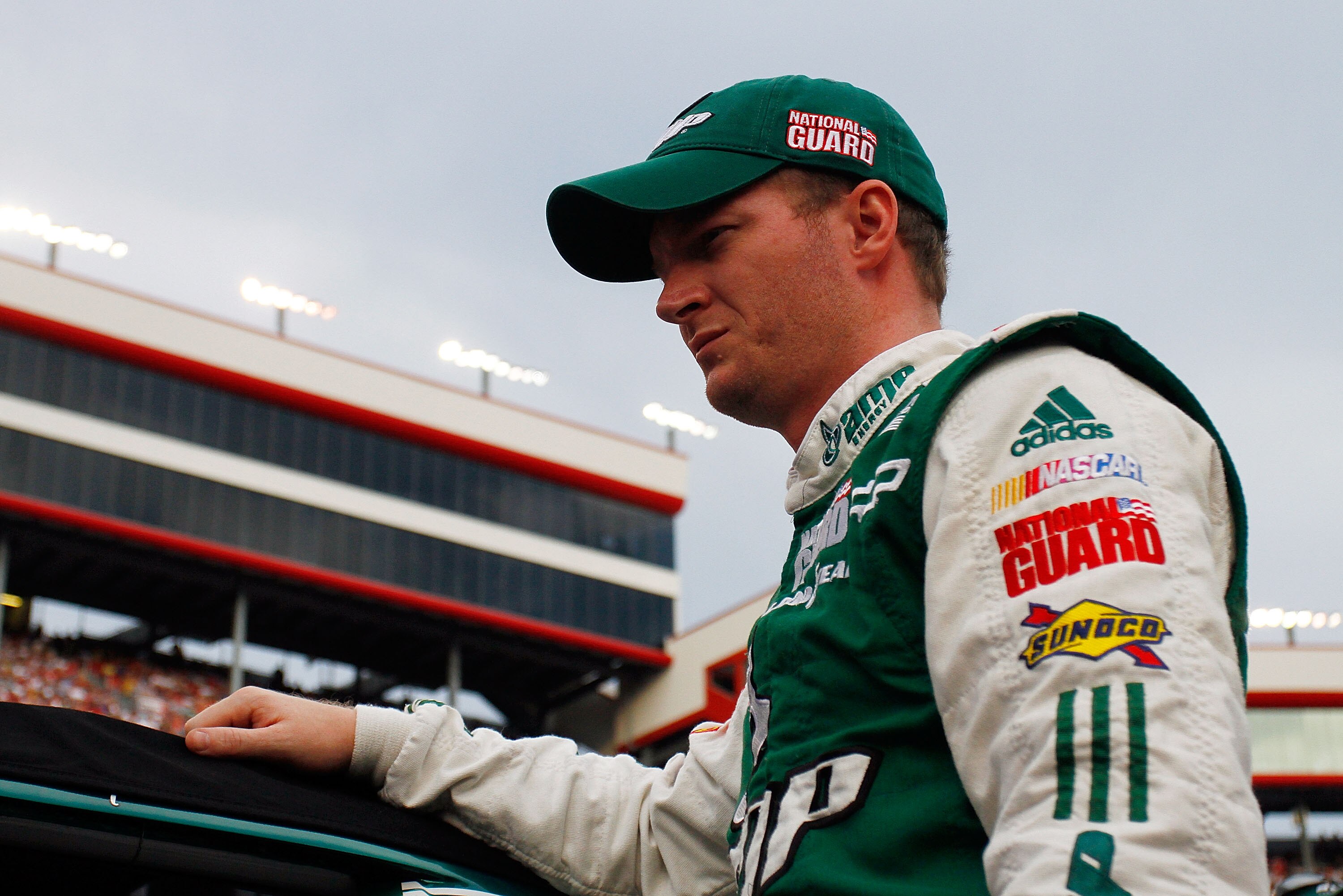 BRISTOL, TN - AUGUST 21:  Dale Earnhardt Jr., driver of the #88 AMP Energy/National Guard Chevrolet, stands on the grid prior to the start of the NASCAR Sprint Cup Series IRWIN Tools Night Race at Bristol Motor Speedway on August 21, 2010 in Bristol, Tenn