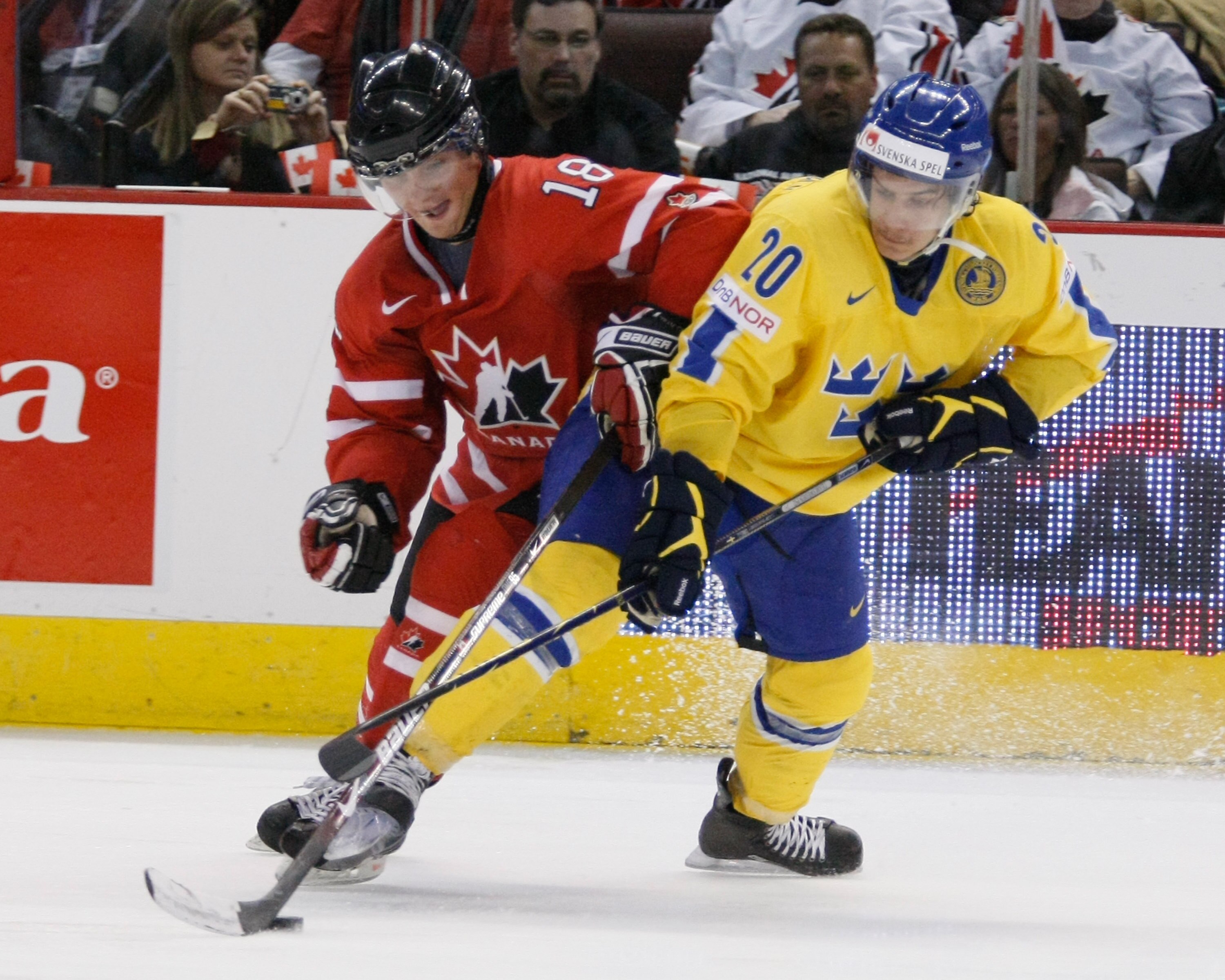 OTTAWA, ON - JANUARY 5:  Cody Hodgson #18 of Team Canada and Andre Petersson #18 of Team Sweden battle for the puck during the Gold Medal Game of the IIHF World Junior Championships at Scotiabank Place on January 05, 2009 in Ottawa, Ontario, Canada.  (Pho