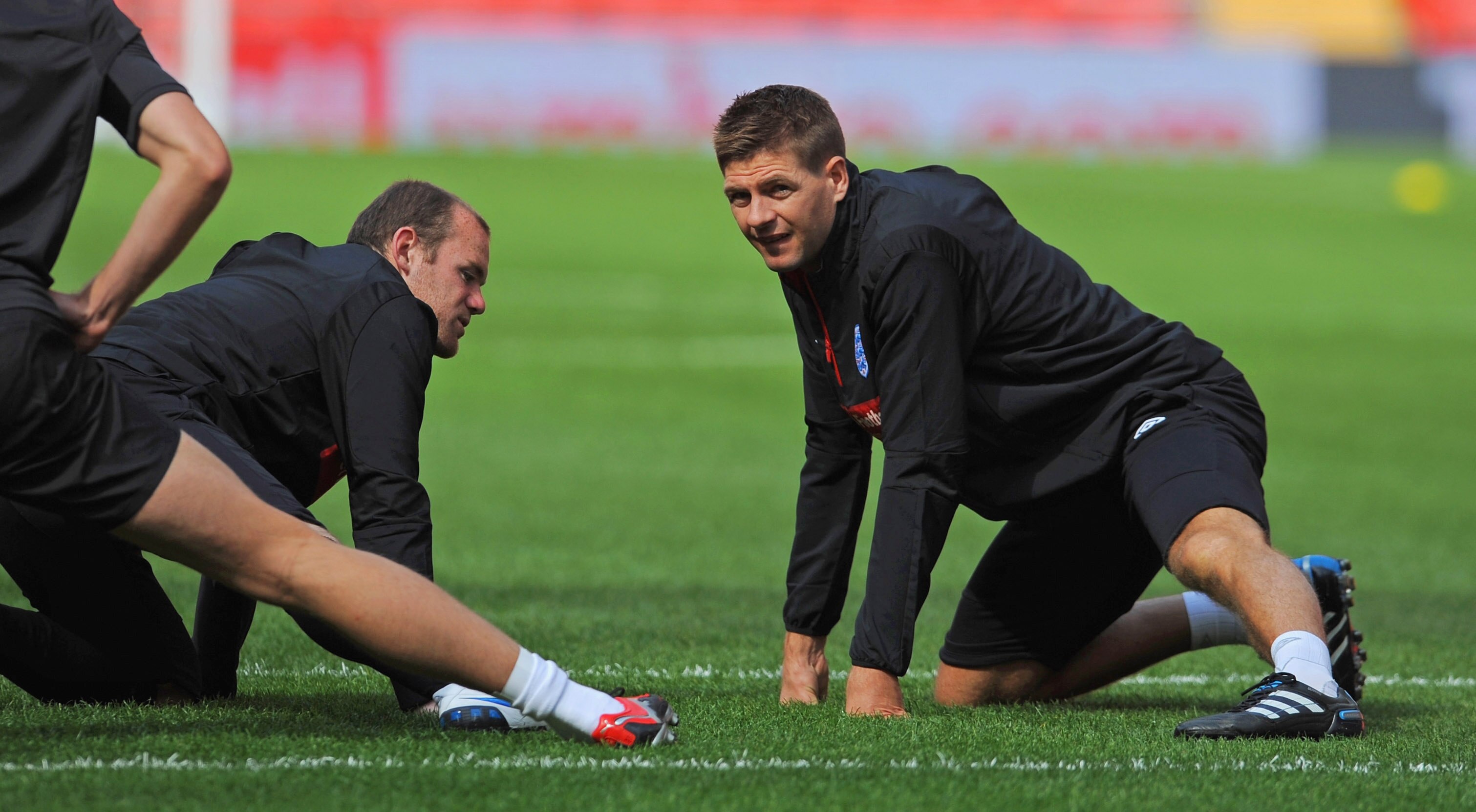 LONDON, ENGLAND - SEPTEMBER 02: Steven Gerrard talks to Wayne Rooney (L) during the England training session at Wembley Stadium on September 2, 2010 in London, England.  (Photo by Michael Regan/Getty Images)