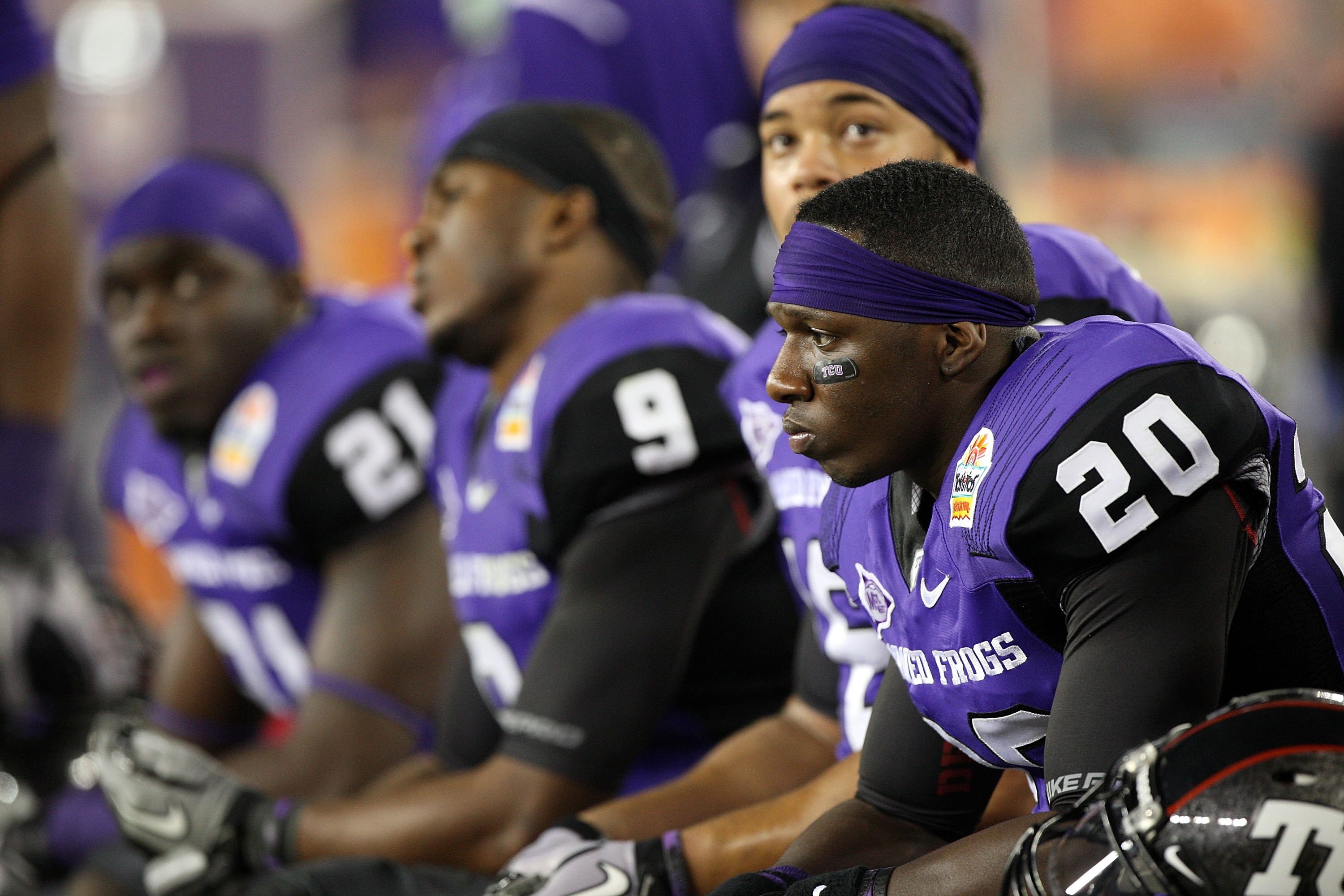 GLENDALE, AZ - JANUARY 04:  Nick Sanders #20 of the TCU Horned Frogs sits on the bench with his teammates against the Boise State Broncos during the Tostitos Fiesta Bowl at the Universtity of Phoenix Stadium on January 4, 2010 in Glendale, Arizona.  (Phot