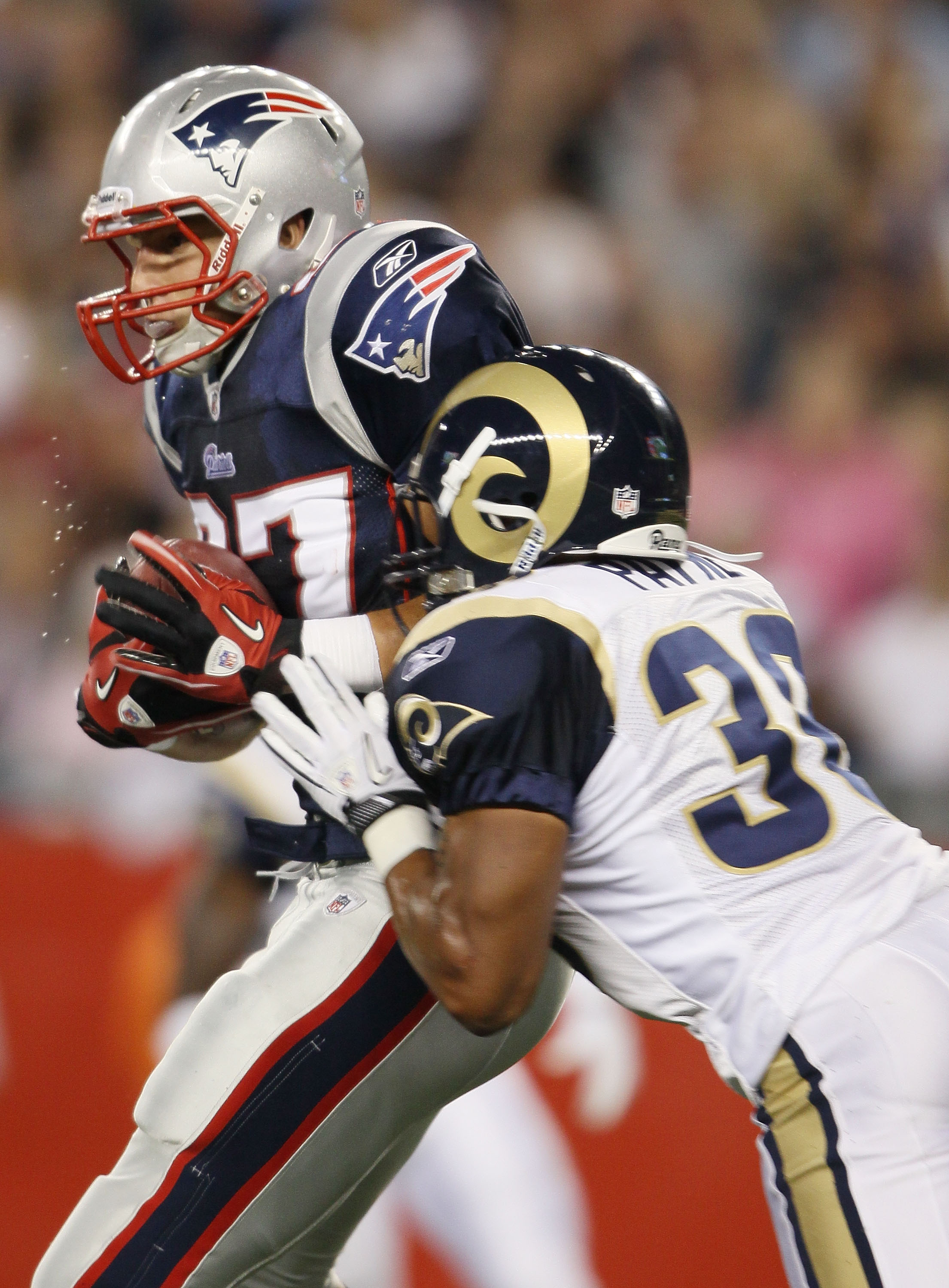 FOXBORO, MA - AUGUST 26:  Rob Gronkowski #87 of the New England Patriots makes a touchdown catch as Kevin Payne #30 of the St. Louis Rams defends on August 26, 2010 at Gillette Stadium in Foxboro, Massachusetts. The Rams defeated the Patriots 36-35.  (Pho