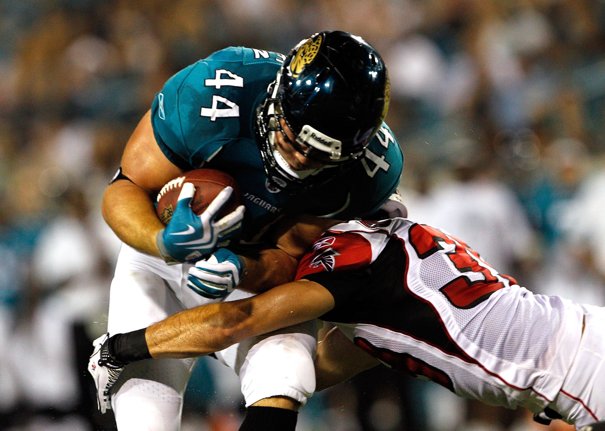 JACKSONVILLE, FL - SEPTEMBER 02:  Brock Bolen #44 of the Jacksonville Jaguars breaks the tackle of Raphael Bush #36 of the Atlanta Falcons to score a touchdown during a preseason game at EverBank Field on September 2, 2010 in Jacksonville, Florida.  (Phot