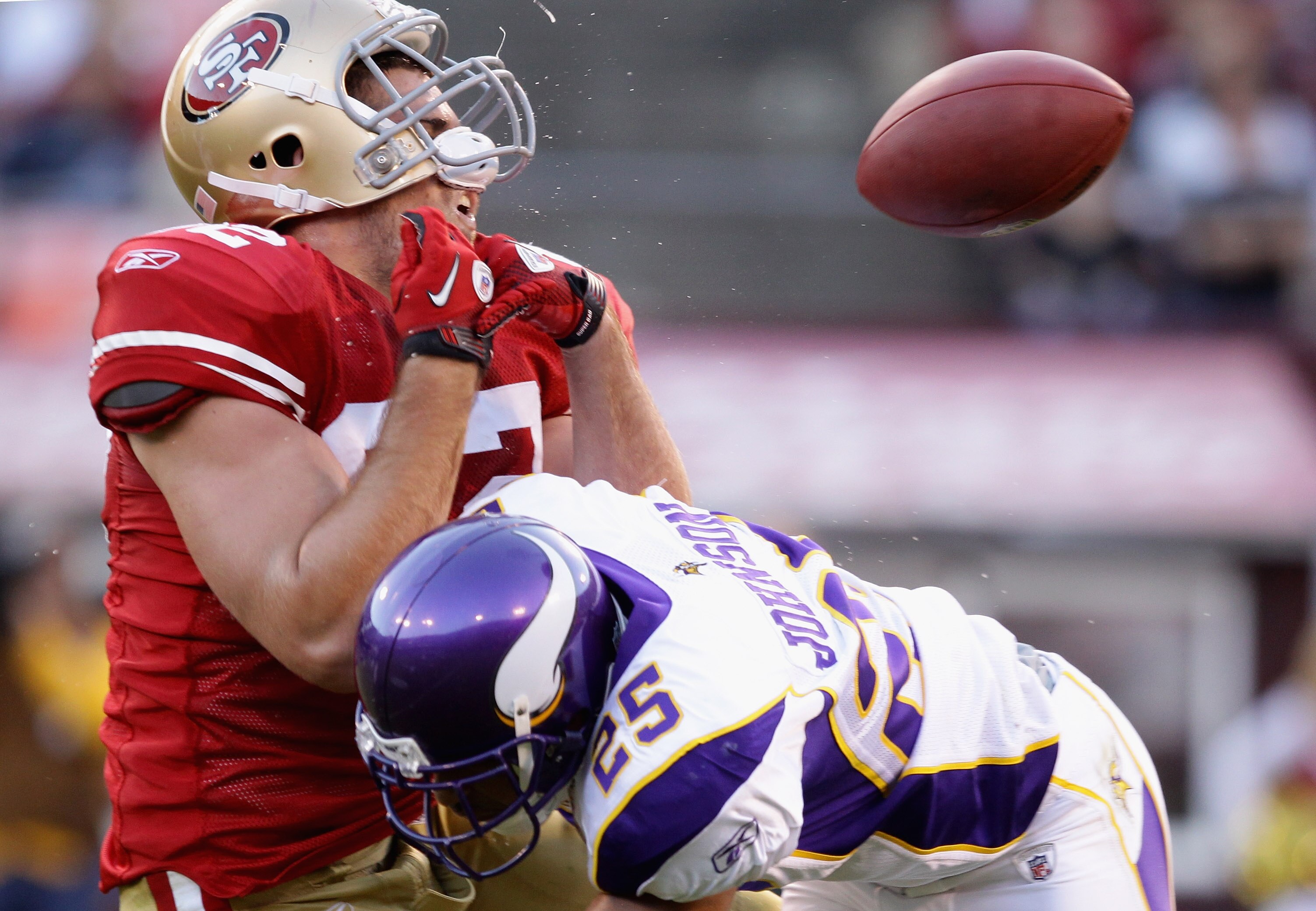 SAN FRANCISCO - AUGUST 22:  Nate Byham #82 of the San Francisco 49ers is hit by Tyrell Johnson #25 of the Minnesota Vikings during a preseason game at Candlestick Park on August 22, 2010 in San Francisco, California.  (Photo by Ezra Shaw/Getty Images)