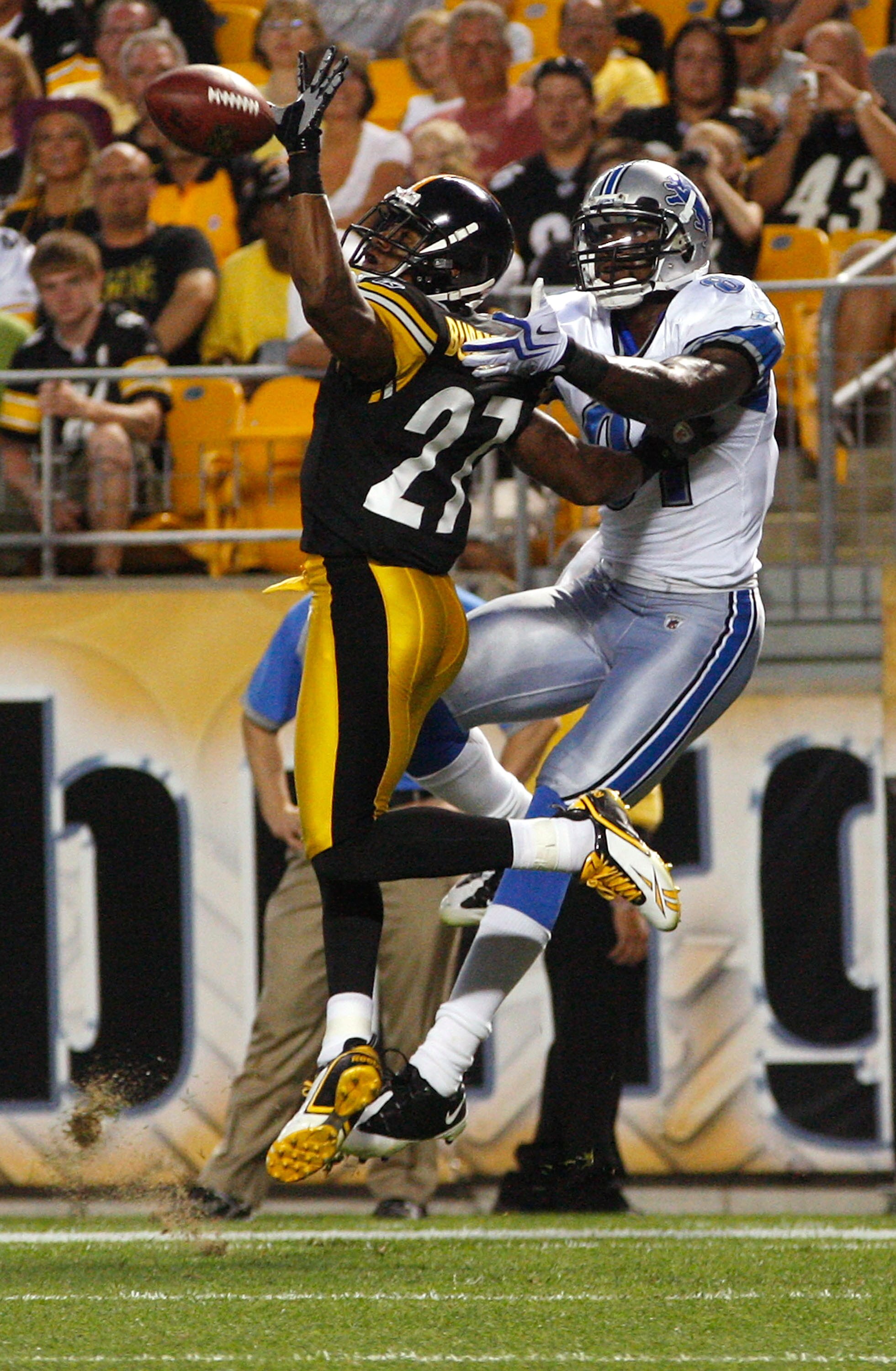 PITTSBURGH - AUGUST 14:  Joe Burnett #27 of the Pittsburgh Steelers deflects a pass in front of Calvin Johnson #81 of the Detroit Lions during the preseason game on August 14, 2010 at Heinz Field in Pittsburgh, Pennsylvania.  (Photo by Jared Wickerham/Get