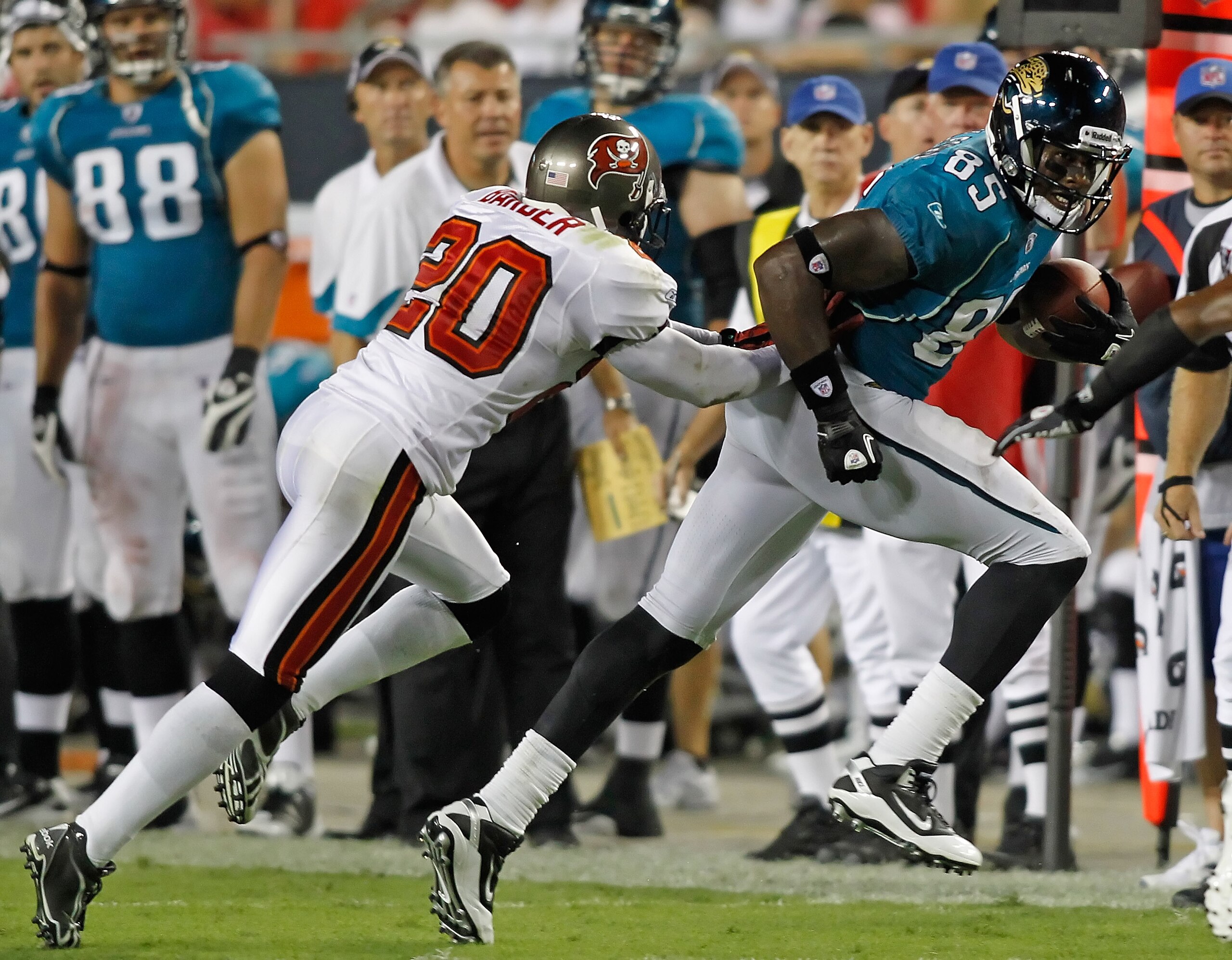 TAMPA, FL - AUGUST 28:  Cornerback Ronde Barber #20 of the Tampa Bay Buccaneers pushes tight end Ernest Wilford #85 of the Jacksonville Jaguars out of bounds during a preseason game at Raymond James Stadium on August 28, 2010 in Tampa, Florida.  (Photo by