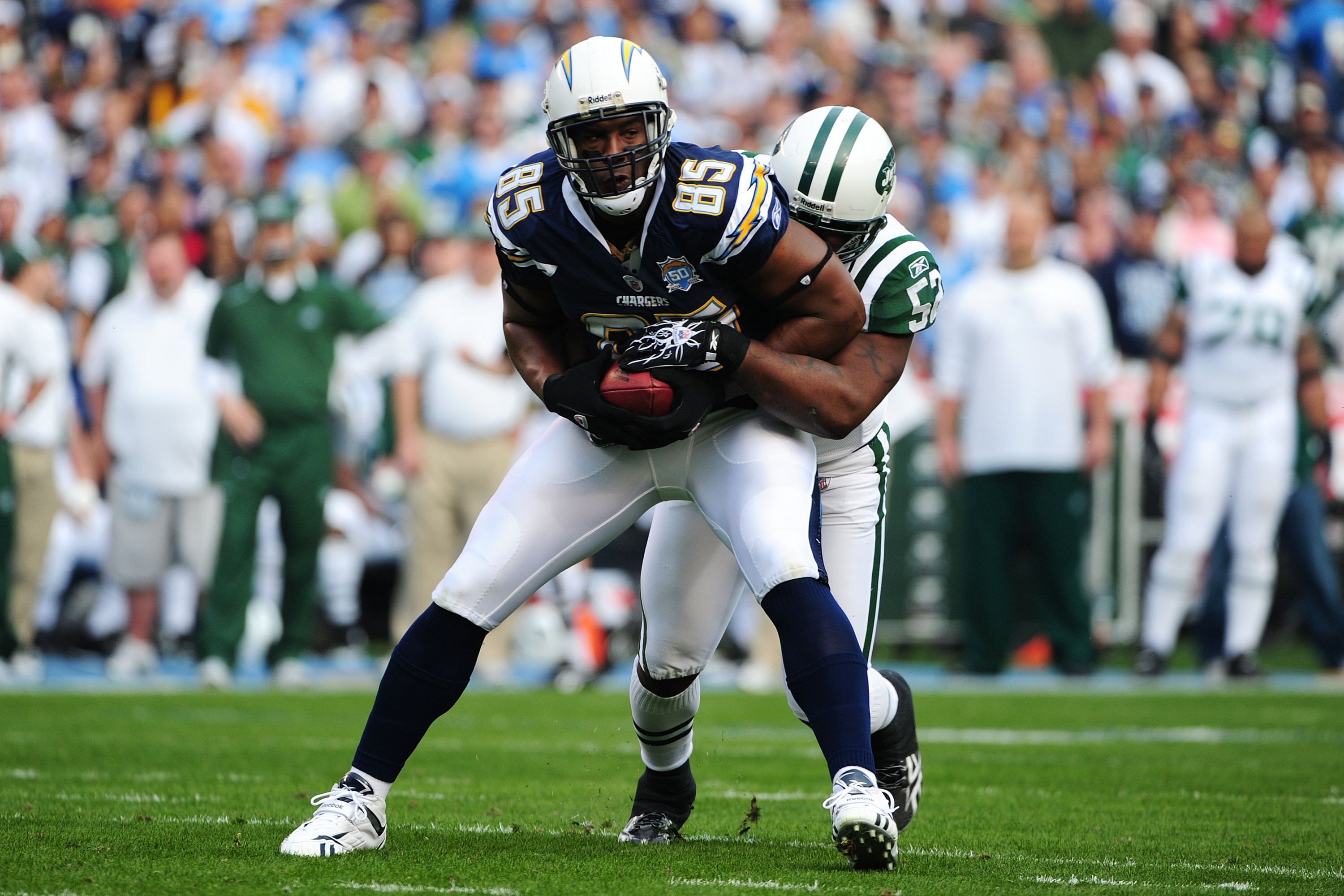 SAN DIEGO - JANUARY 17:  Tight end Antonio Gates #85 of the San Diego Chargers fights for extra yards after making a catch against the New York Jets in the AFC Divisional Playoff Game at Qualcomm Stadium on January 17, 2010 in San Diego, California.  (Pho