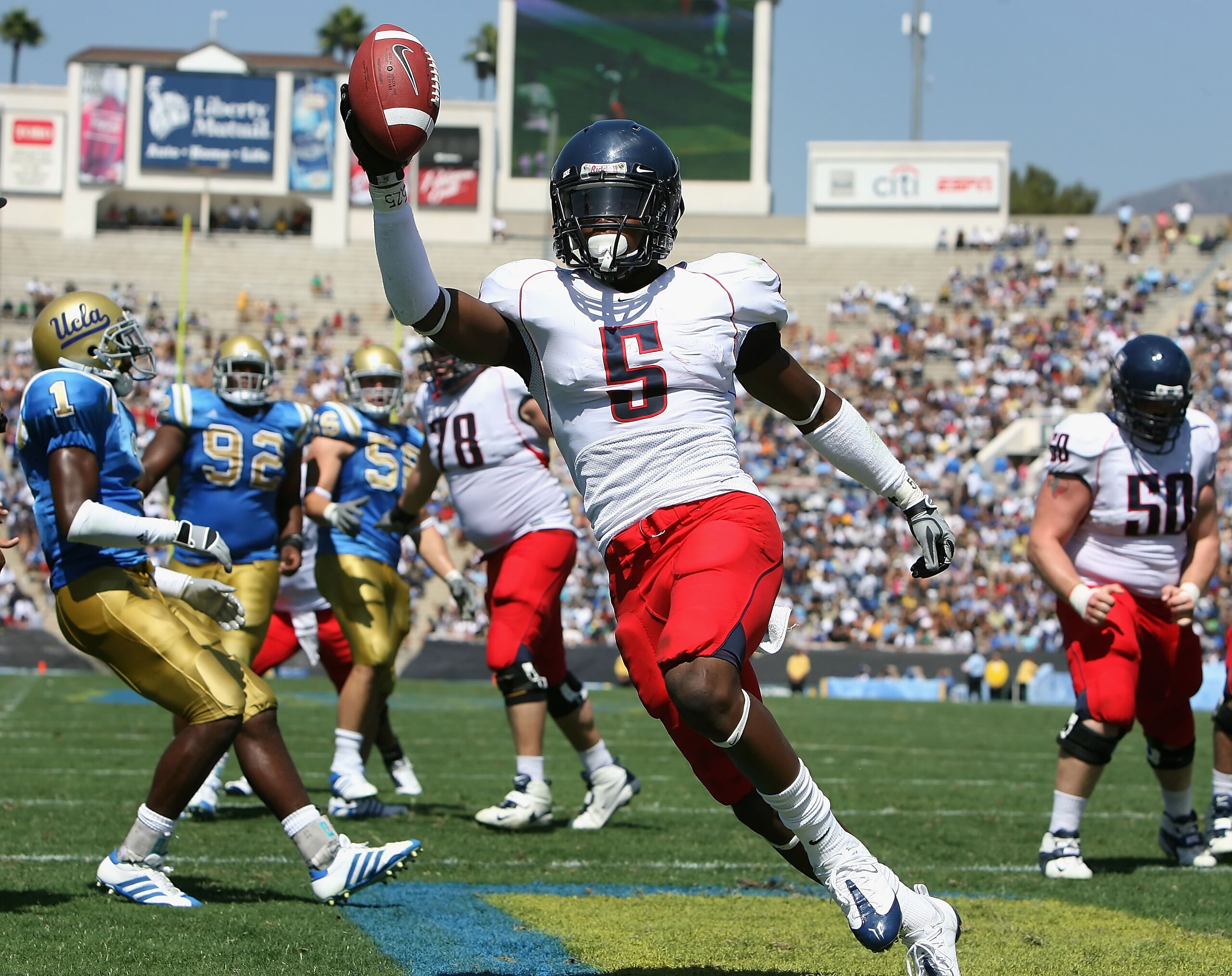 PASADENA, CA - SEPTEMBER 20:  Running back Nic Grigsby #5 of the Arizona Wildcats celebrates after scoring a 3 yard rushing touchdown against the UCLA Bruins during the second quarter of the college football game at the Rose Bowl on September 20, 2008 in