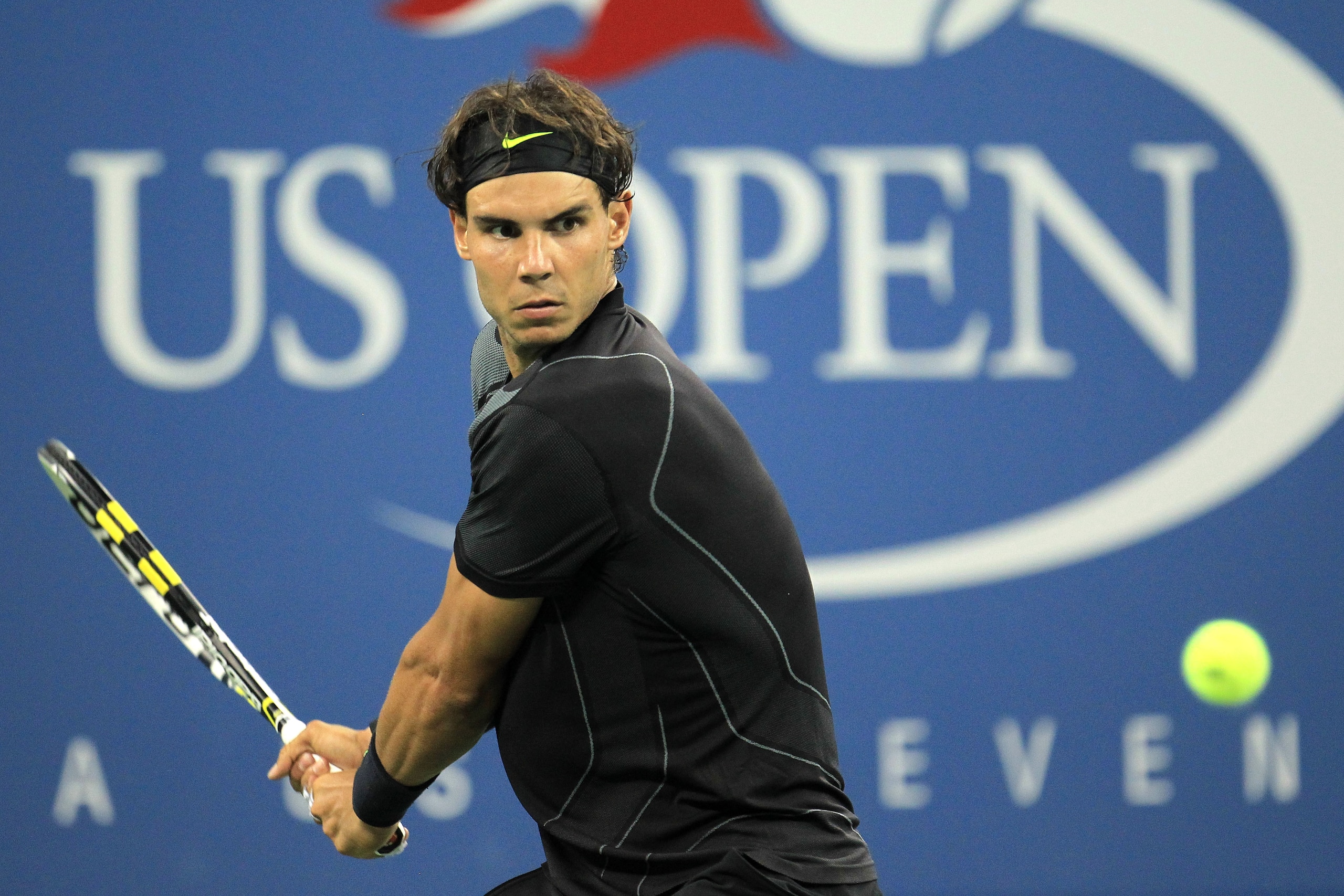 NEW YORK - AUGUST 31:  Rafael Nadal of Spain returns a shot against Teymuraz Gabashvili of Russia during his first round men's single's match on day two of the 2010 U.S. Open at the USTA Billie Jean King National Tennis Center on August 31, 2010 in the Fl