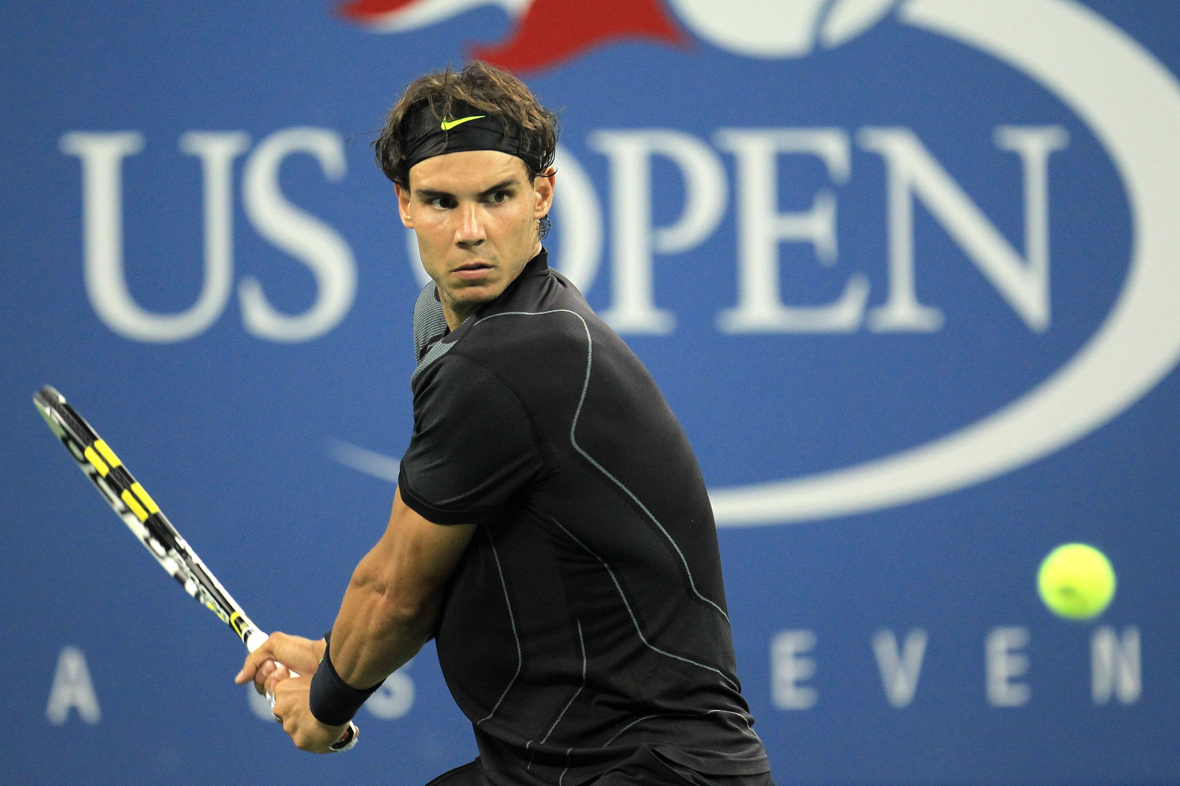 NEW YORK - AUGUST 31: Rafael Nadal of Spain returns a shot against Teymuraz Gabashvili of Russia during his first round men's single's match on day two of the 2010 U.S. Open at the USTA Billie Jean King National Tennis Center on August 31, 2010 in the Fl NEW YORK - AUGUST 31: Rafael Nadal of Spain returns a shot against Teymuraz Gabashvili of Russia during his first round men's single's match on day two of the 2010 U.S. Open at the USTA Billie Jean King National Tennis Center on August 31, 2010 in the Fl
