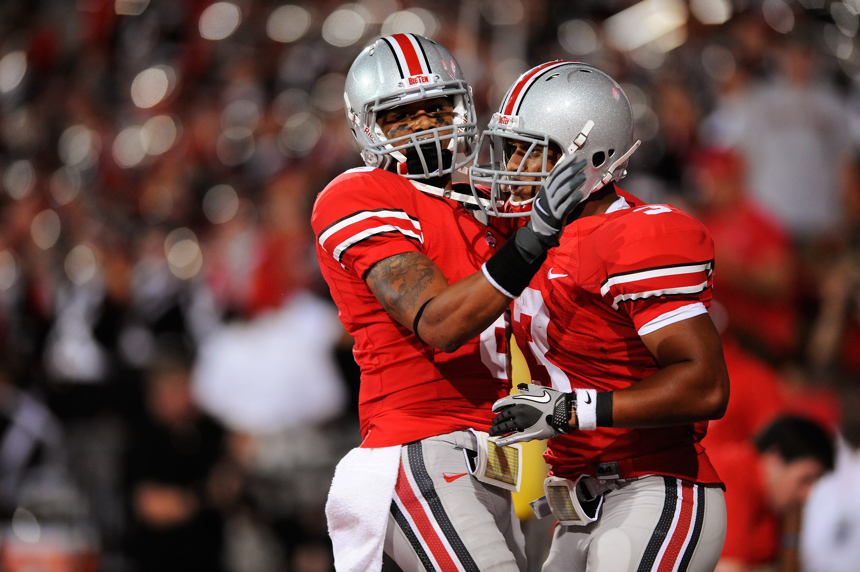 COLUMBUS, OH - SEPTEMBER 2: DeVier Posey #8 of the Ohio State Buckeyes congratulates teammate Brandon Saine #3 of the Ohio State Buckeyes after a 45-yard touchdown run by Saine against the Marshall Thundering Herd at Ohio Stadium on September 2, 2010 in COLUMBUS, OH - SEPTEMBER 2: DeVier Posey #8 of the Ohio State Buckeyes congratulates teammate Brandon Saine #3 of the Ohio State Buckeyes after a 45-yard touchdown run by Saine against the Marshall Thundering Herd at Ohio Stadium on September 2, 2010 in