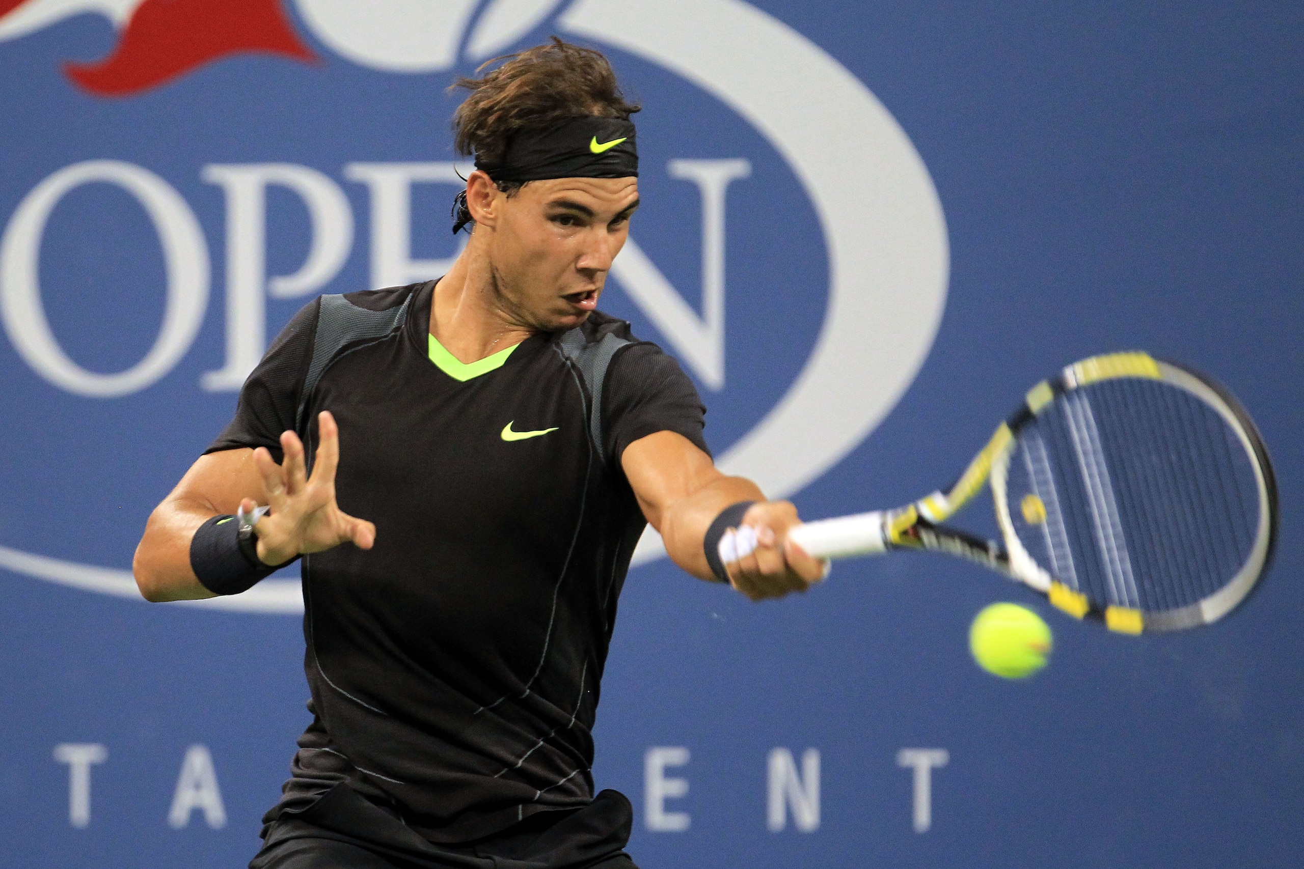 NEW YORK - AUGUST 31:  Rafael Nadal of Spain returns a shot against Teymuraz Gabashvili of Russia during his first round men's single's match on day two of the 2010 U.S. Open at the USTA Billie Jean King National Tennis Center on August 31, 2010 in the Fl