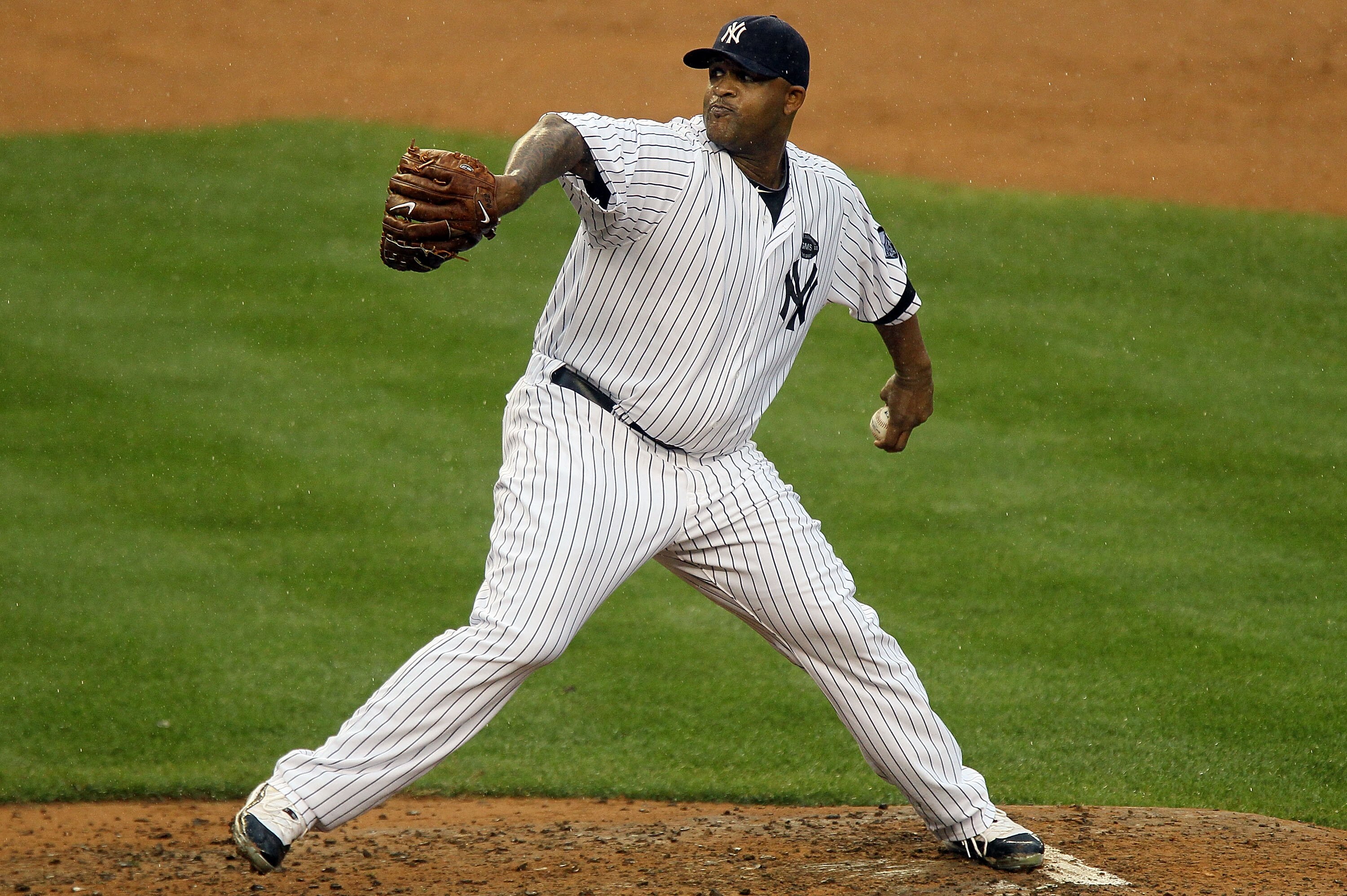 NEW YORK - AUGUST 22:  CC Sabathia #52 of the New York Yankees delivers a pitch against the Seattle Mariners on August 22, 2010 at Yankee Stadium in the Bronx borough of New York City.  (Photo by Jim McIsaac/Getty Images)