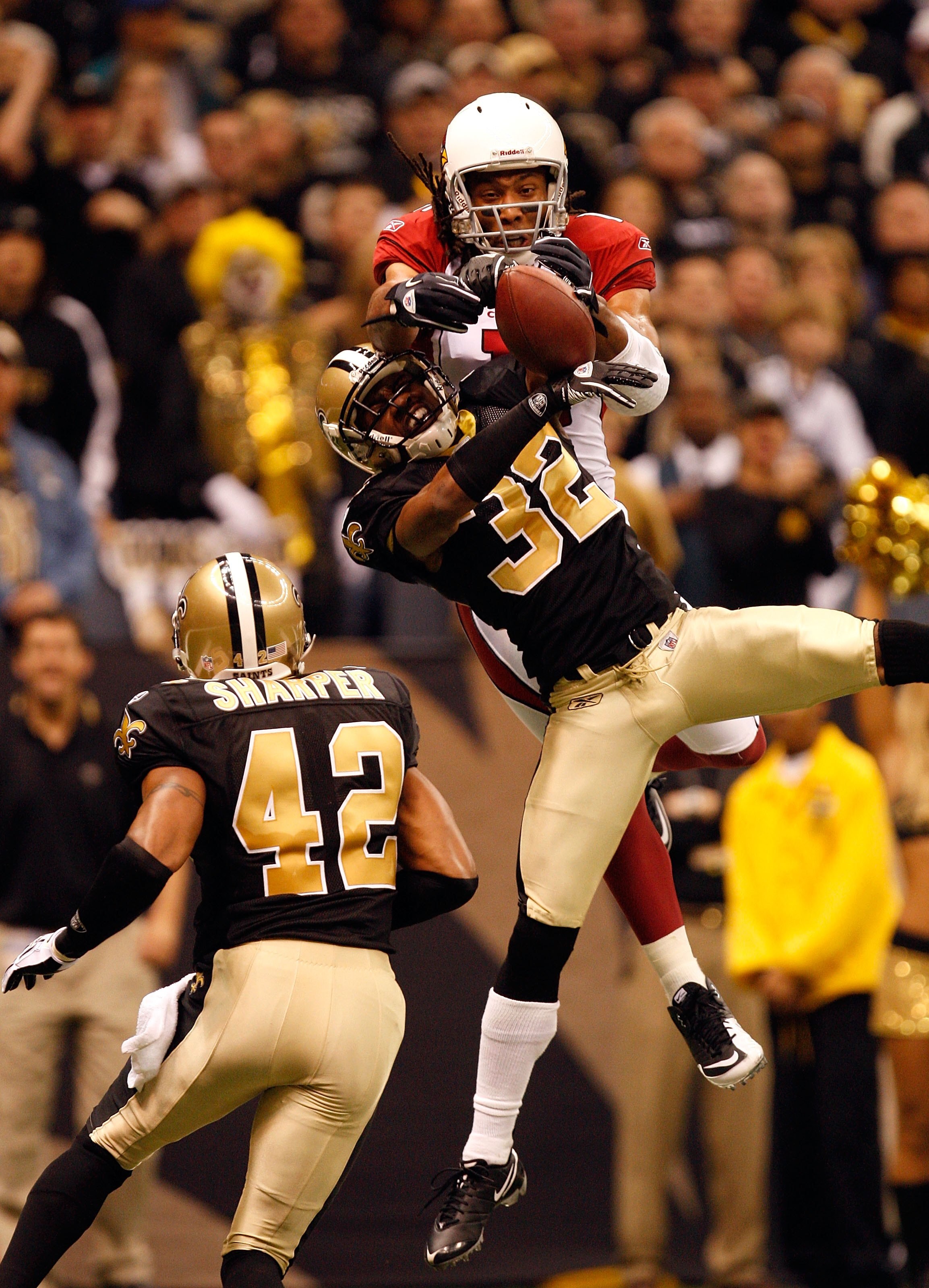 NEW ORLEANS - JANUARY 16: Larry Fitzgerald #11 of the Arizona Cardinals fails to come a reception in the endzone against Jabari Greer #32 and Darren Sharper #42 of the New Orleans Saints during the NFC Divisional Playoff Game at Louisana Superdome on Jan NEW ORLEANS - JANUARY 16: Larry Fitzgerald #11 of the Arizona Cardinals fails to come a reception in the endzone against Jabari Greer #32 and Darren Sharper #42 of the New Orleans Saints during the NFC Divisional Playoff Game at Louisana Superdome on Jan