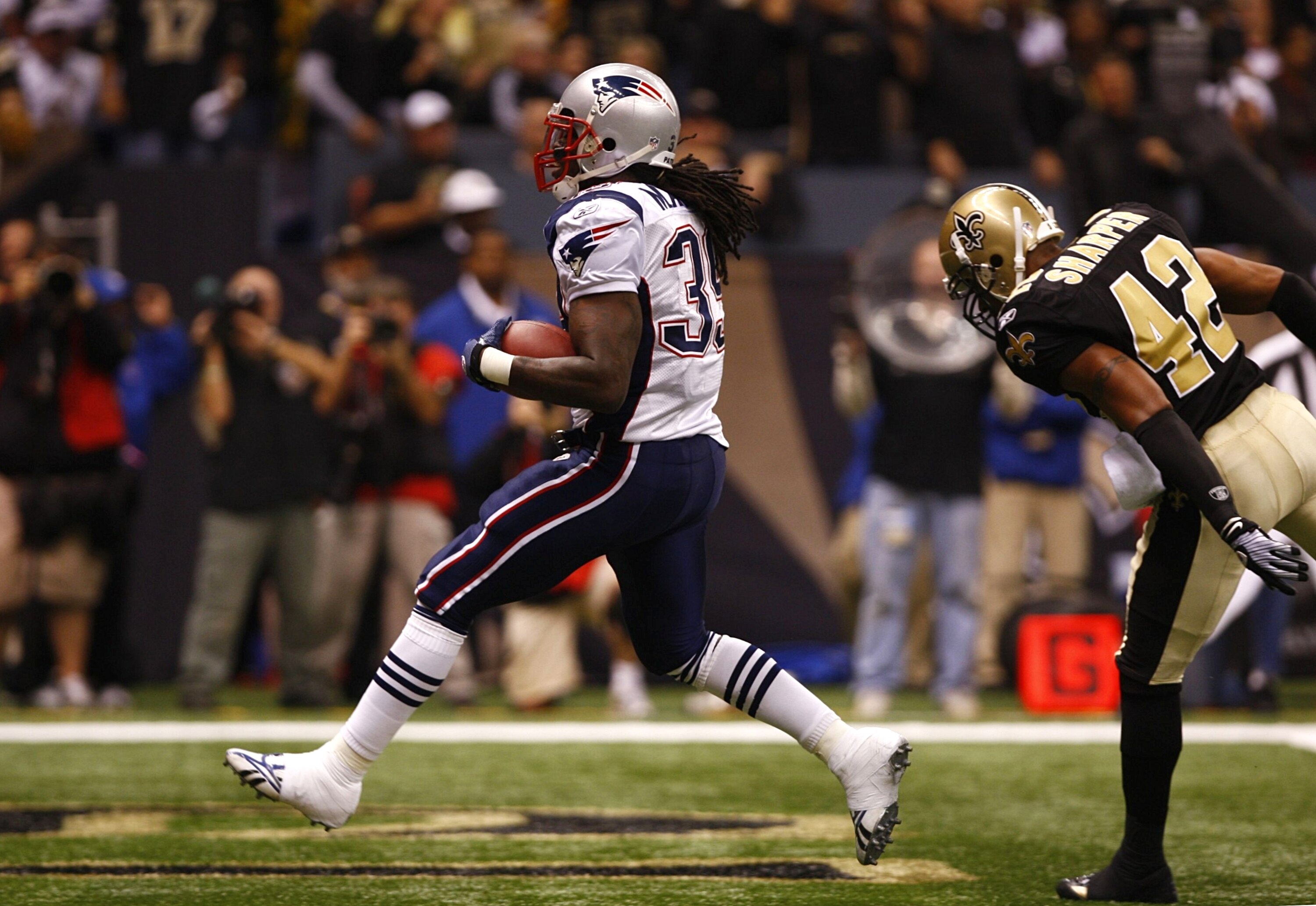 NEW ORLEANS - NOVEMBER 30: Laurence Maroney #39 of the New England Patriots scores a 4-yard rushing touchdown during the first quarter of the game against Darren Sharper #42 of the New Orleans Saints at Louisana Superdome on November 30, 2009 in New Orlea NEW ORLEANS - NOVEMBER 30: Laurence Maroney #39 of the New England Patriots scores a 4-yard rushing touchdown during the first quarter of the game against Darren Sharper #42 of the New Orleans Saints at Louisana Superdome on November 30, 2009 in New Orlea