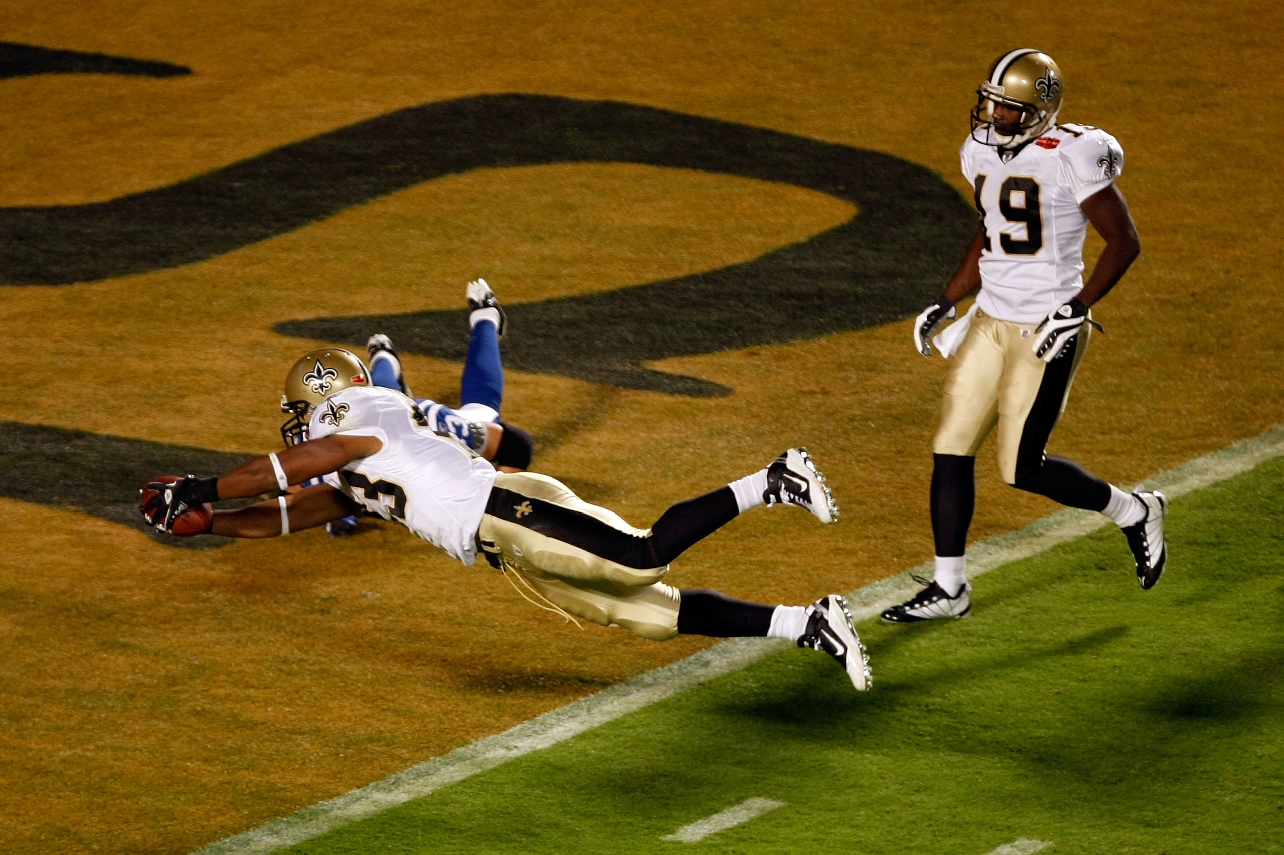 MIAMI GARDENS, FL - FEBRUARY 07:  Pierre Thomas #23 of the New Orleans Saints dives into the endzone for a touchdown in the third quarter against the Indianapolis Colts during Super Bowl XLIV on February 7, 2010 at Sun Life Stadium in Miami Gardens, Flori