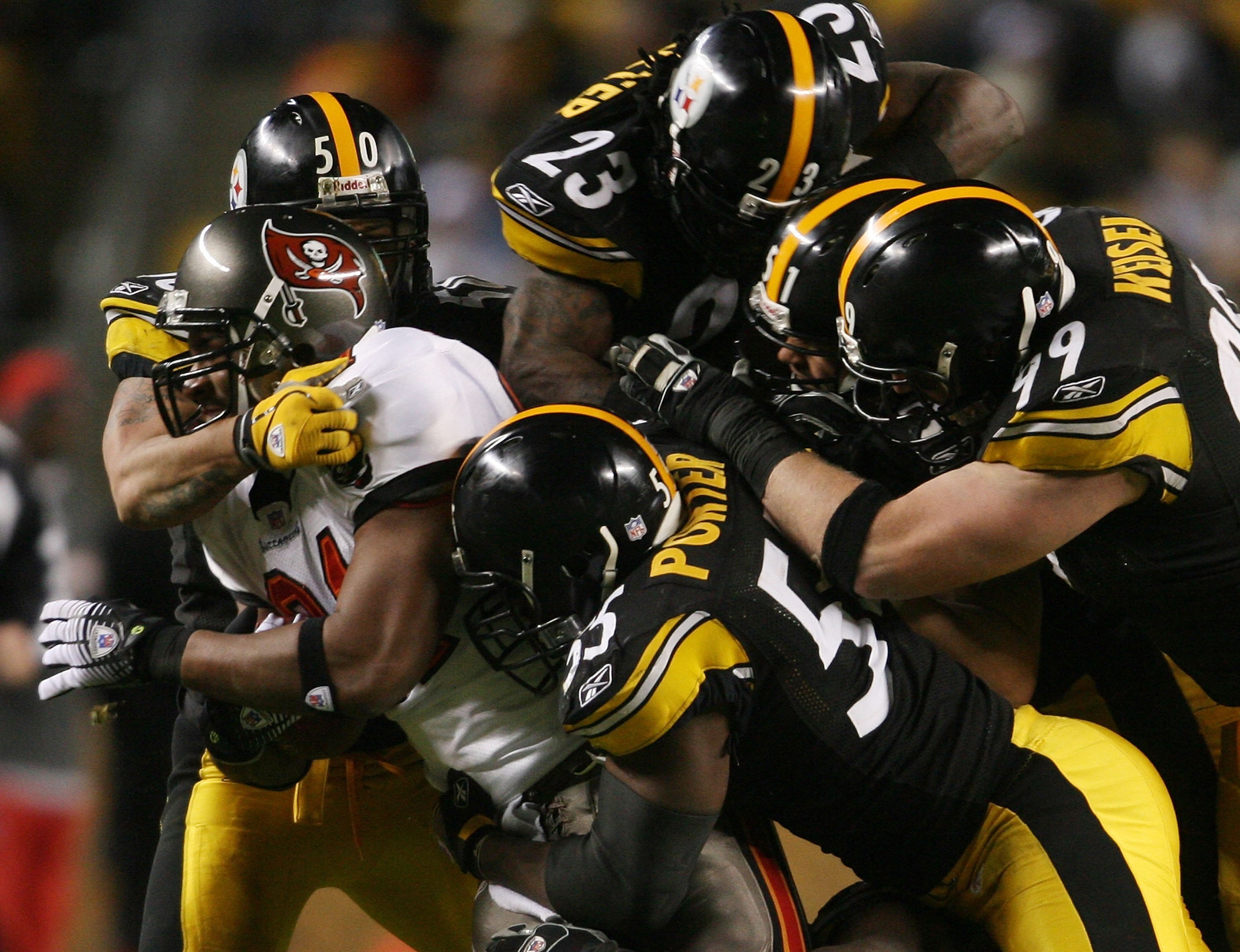 PITTSBURGH - DECEMBER 3:   Alex Smith #81 of the Tampa Bay Buccaneers is tackled by the Pittsburgh Steelers defence at Heinz Field on December 3, 2006 in Pittsburgh, Pennsylvania.  (Photo by Nick Laham/Getty Images)