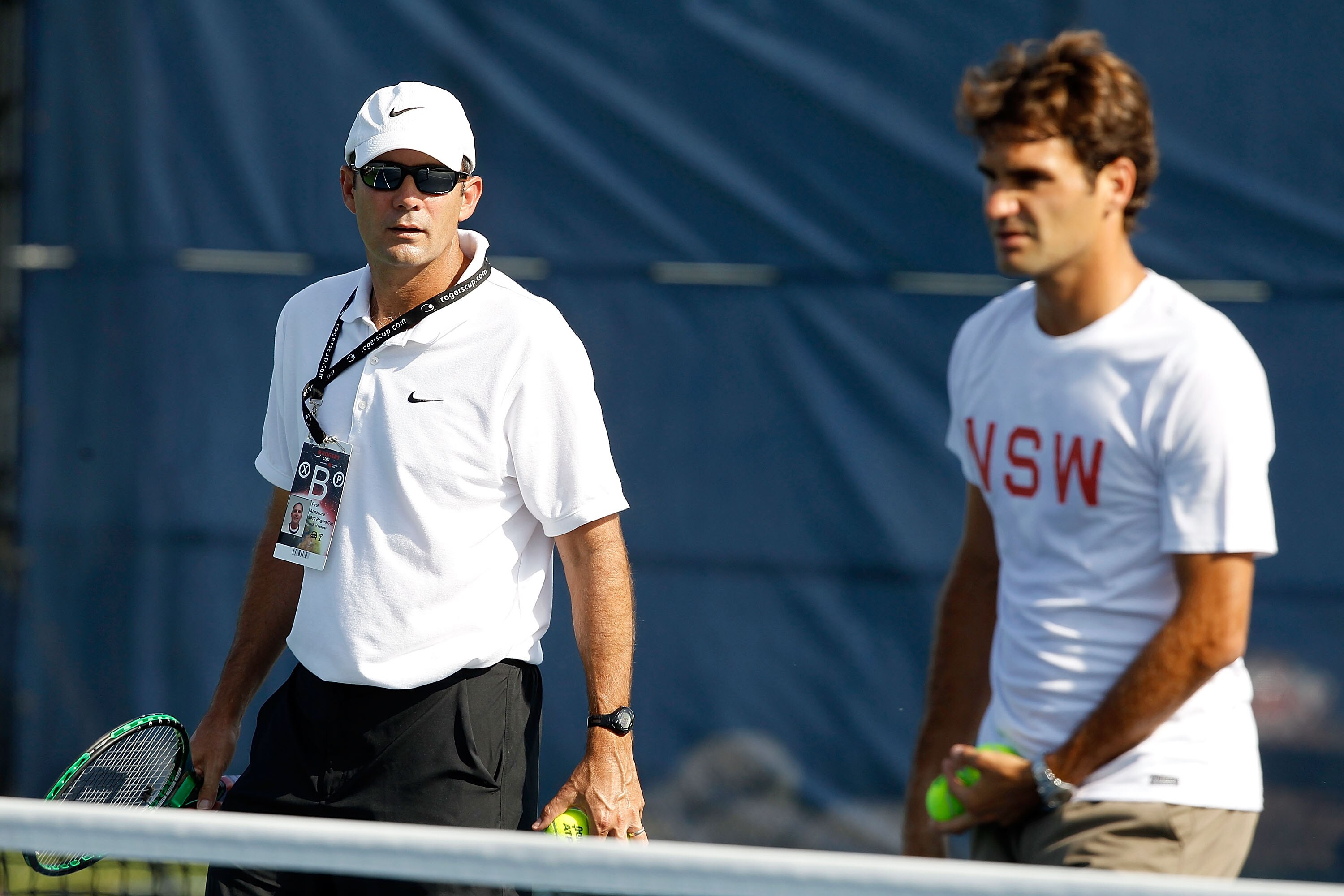 TORONTO, ON - AUGUST 10: Paul Annacone in practice with Roger Federer of Switzerland during the Rogers Cup at the Rexall Centre on August 10, 2010 in Toronto, Canada.  (Photo by Matthew Stockman/Getty Images)