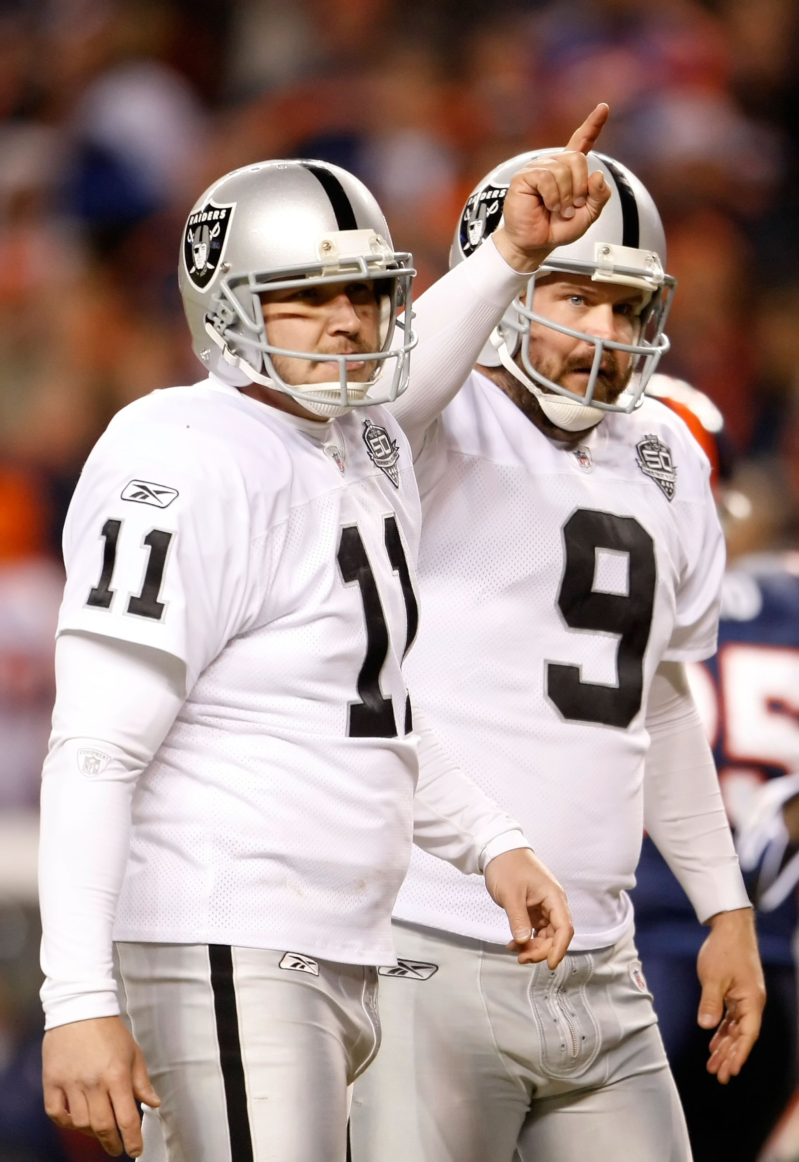 DENVER - DECEMBER 20:  Sebastian Janikowski #11 and Shane Lechler #9 of the Oakland Raiders celebrate the extra point after Chaz Schilens' touchdown in the fourth quarter against the Denver Broncos at Invesco Field at Mile High on December 20, 2009 in Den