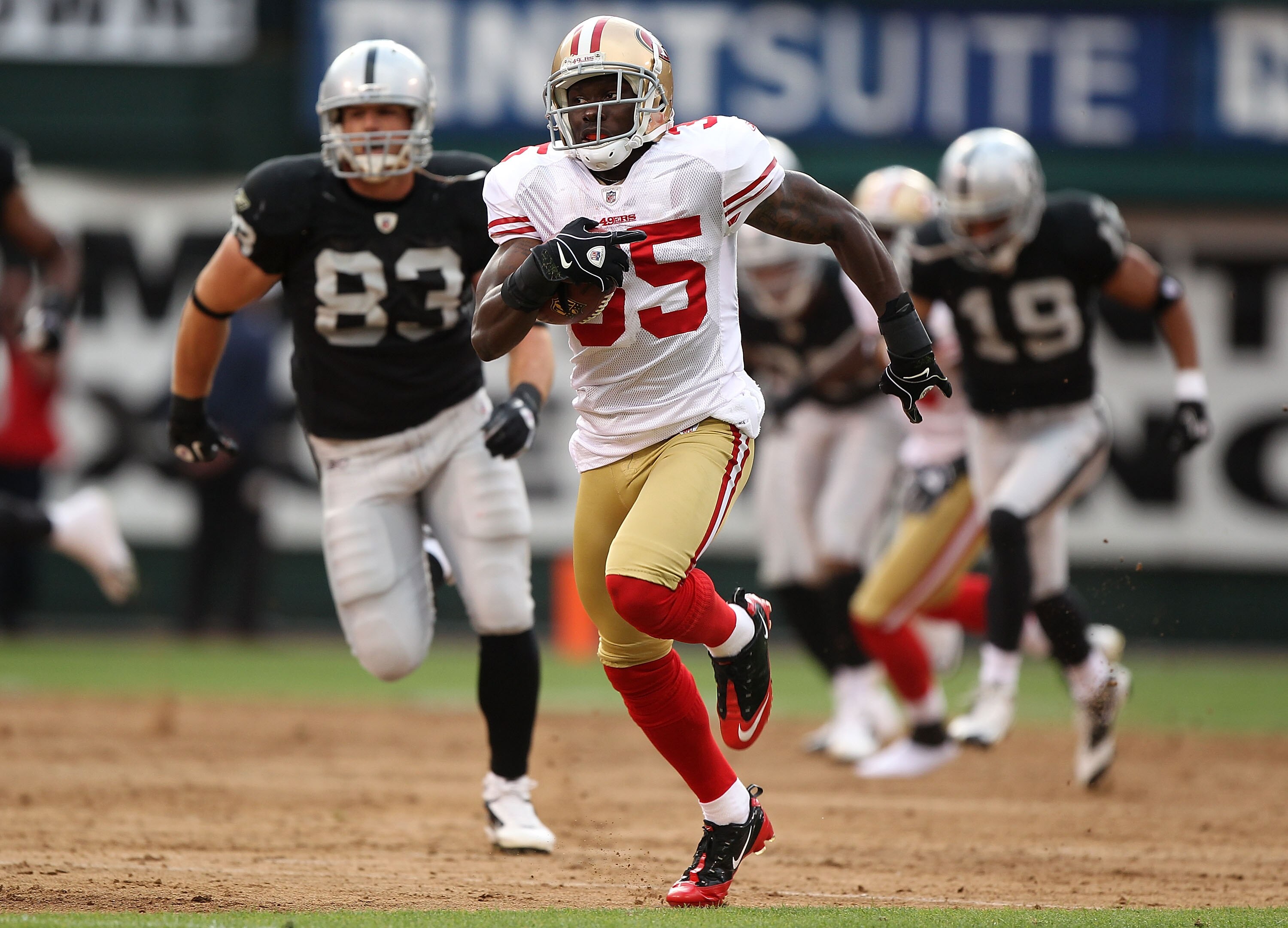 OAKLAND, CA - AUGUST 28:  Phillip Adams #35 of the San Francisco 49ers runs for a touchdown on a punt return against the Oakland Raiders during an NFL preseason game at Oakland-Alameda County Coliseum on August 28, 2010 in Oakland, California.  (Photo by 