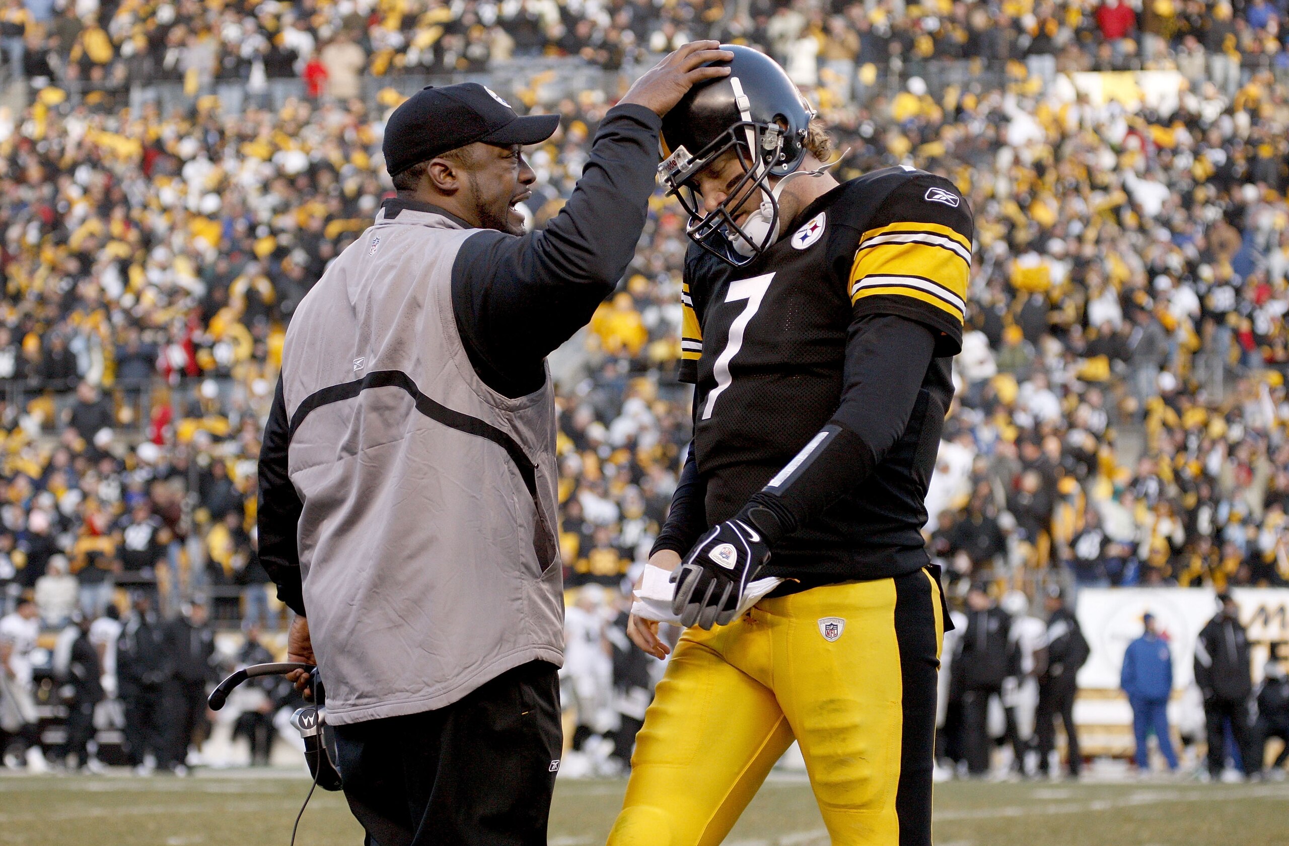 PITTSBURGH - DECEMBER 06: Ben Roethlisberger #7 of the Pittsburgh Steelers is congratulated by head coach Mike Tomlin after throwing a fourth quarter touchdown pass while playing the the Oakland Raiders December 6, 2009 at Heinz Field in Pittsburgh, Penns