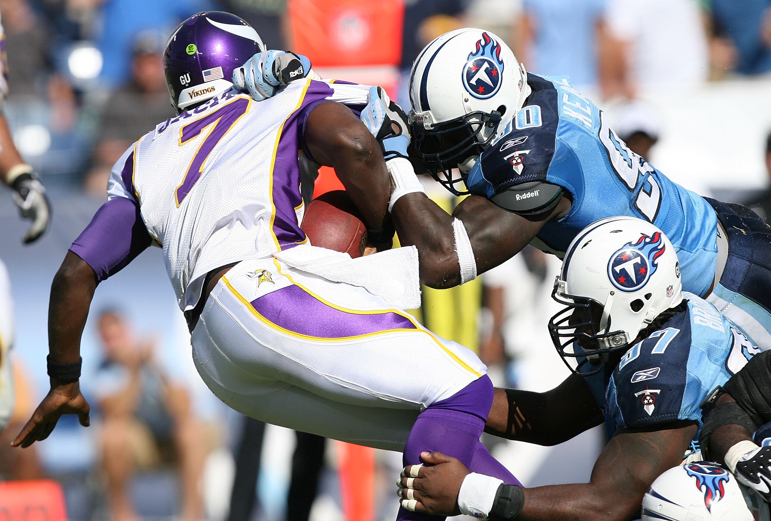 NASHVILLE, TN - SEPTEMBER 28:  Quarterback Tarvaris Jackson #7 of the Minnesota Vikings is sacked by Jevon Kearse #90, Tony Brown #97 and Kyle Vanden Bosch #93 of the Tennessee Titans at LP Field on September 28, 2008 in Nashville, Tennessee. The Titans d