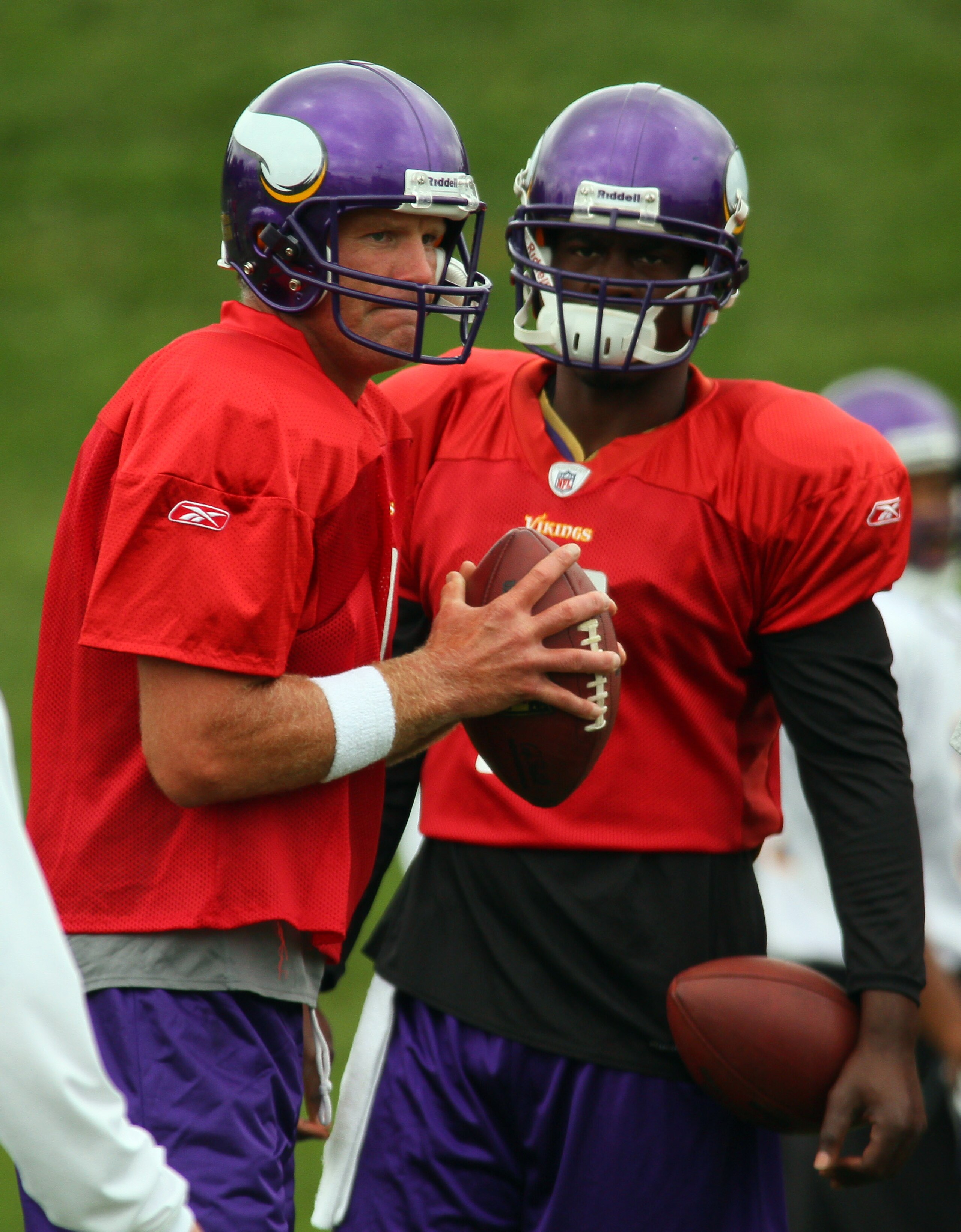 EDEN PRAIRIE, MN - AUGUST 18: Quarterbacks Brett Favre #4 and Tarvaris Jackson #7 of the Minnesota Vikings participate in Favre's first morning practice since returning to Vikings Winter Park on August 18, 2010 in Eden Prairie, Minnesota. Favre injured hi