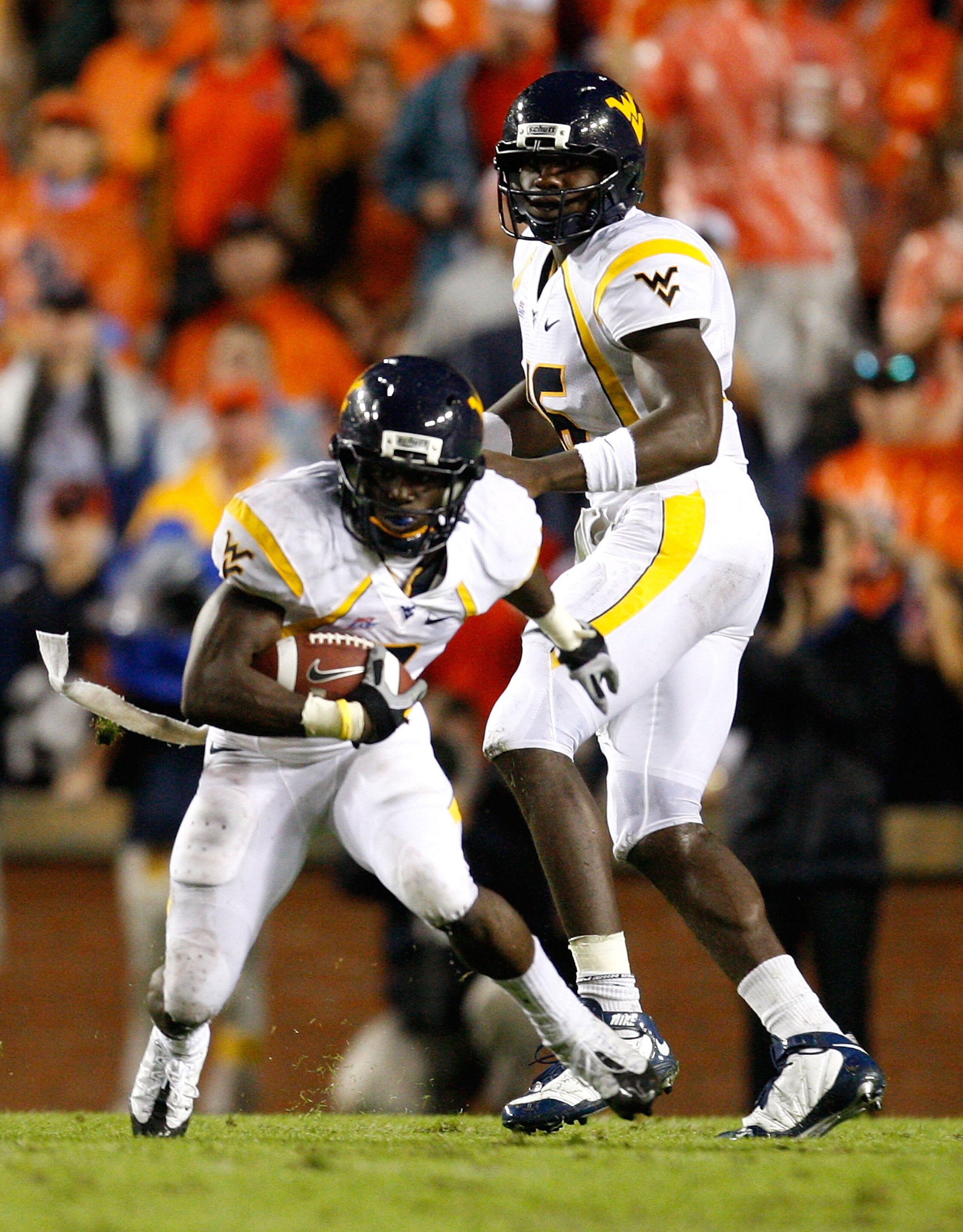AUBURN, AL - SEPTEMBER 19: Quarterback Jarrett Brown #16 and Noel Devine #7 of the West Virginia Mountaineers against the Auburn Tigers at Jordan-Hare Stadium on September 19, 2009 in Auburn, Alabama. (Photo by Kevin C. Cox/Getty Images) AUBURN, AL - SEPTEMBER 19: Quarterback Jarrett Brown #16 and Noel Devine #7 of the West Virginia Mountaineers against the Auburn Tigers at Jordan-Hare Stadium on September 19, 2009 in Auburn, Alabama. (Photo by Kevin C. Cox/Getty Images)