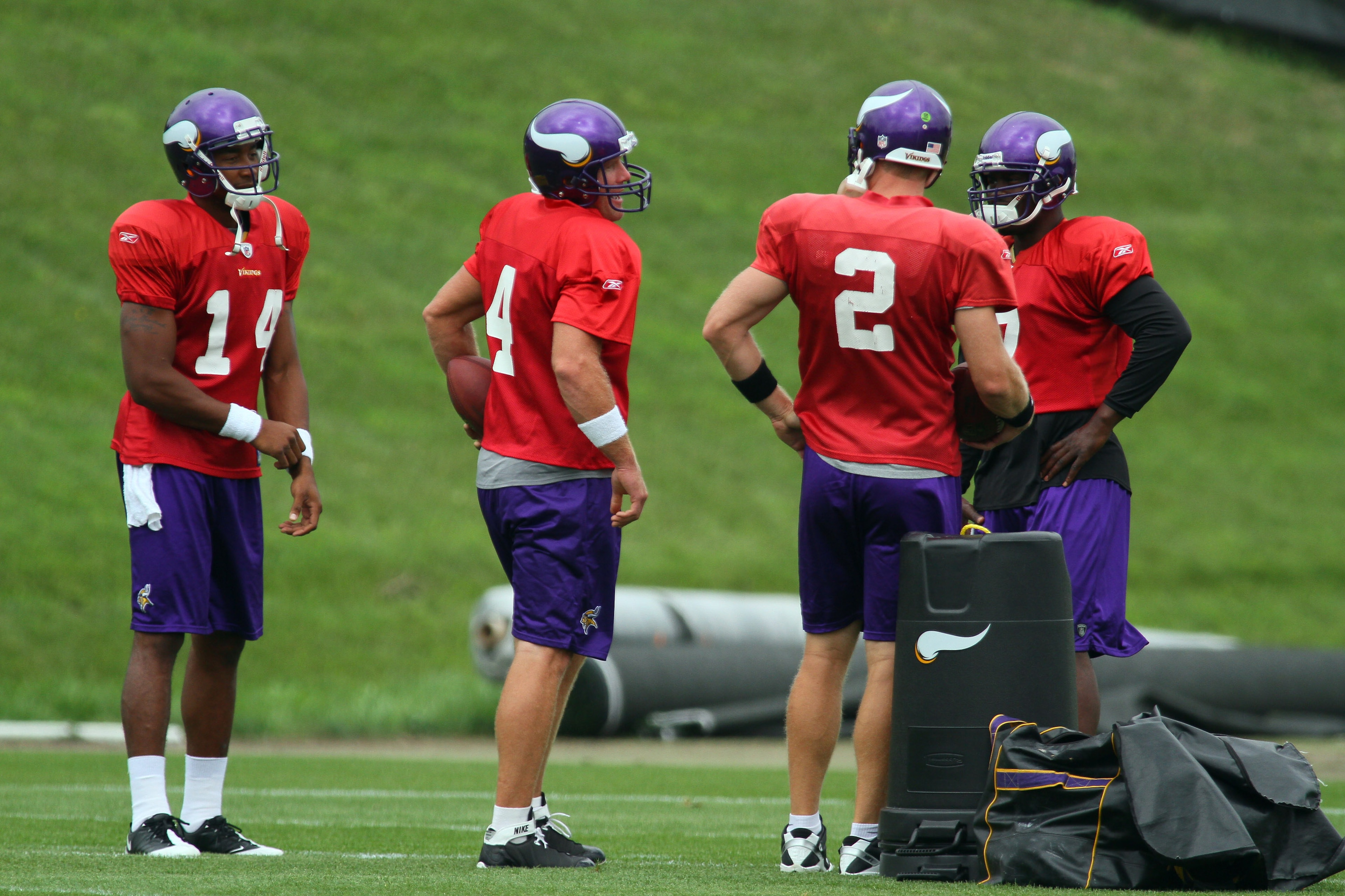EDEN PRAIRIE, MN - AUGUST 18: Quarterbacks Joe Webb #14, Brett Favre #4, Sage Rosenfels #2 and Tarvaris Jackson #7 of the Minnesota Vikings participate Favre's first morning practice since returning to Vikings Winter Park on August 18, 2010 in Eden Prairi