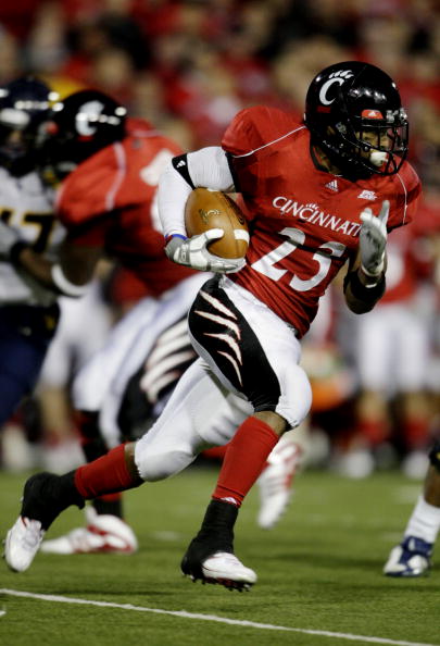 CINCINNATI - NOVEMBER 13:  Isaiah Pead #23 of the Cincinnati Bearcats carries the ball against the West Virginia Mountaineers in the fourth quarter of the game at Nippert Stadium on November 13, 2009 in Cincinnati, Ohio.  (Photo by Andy Lyons/Getty Images