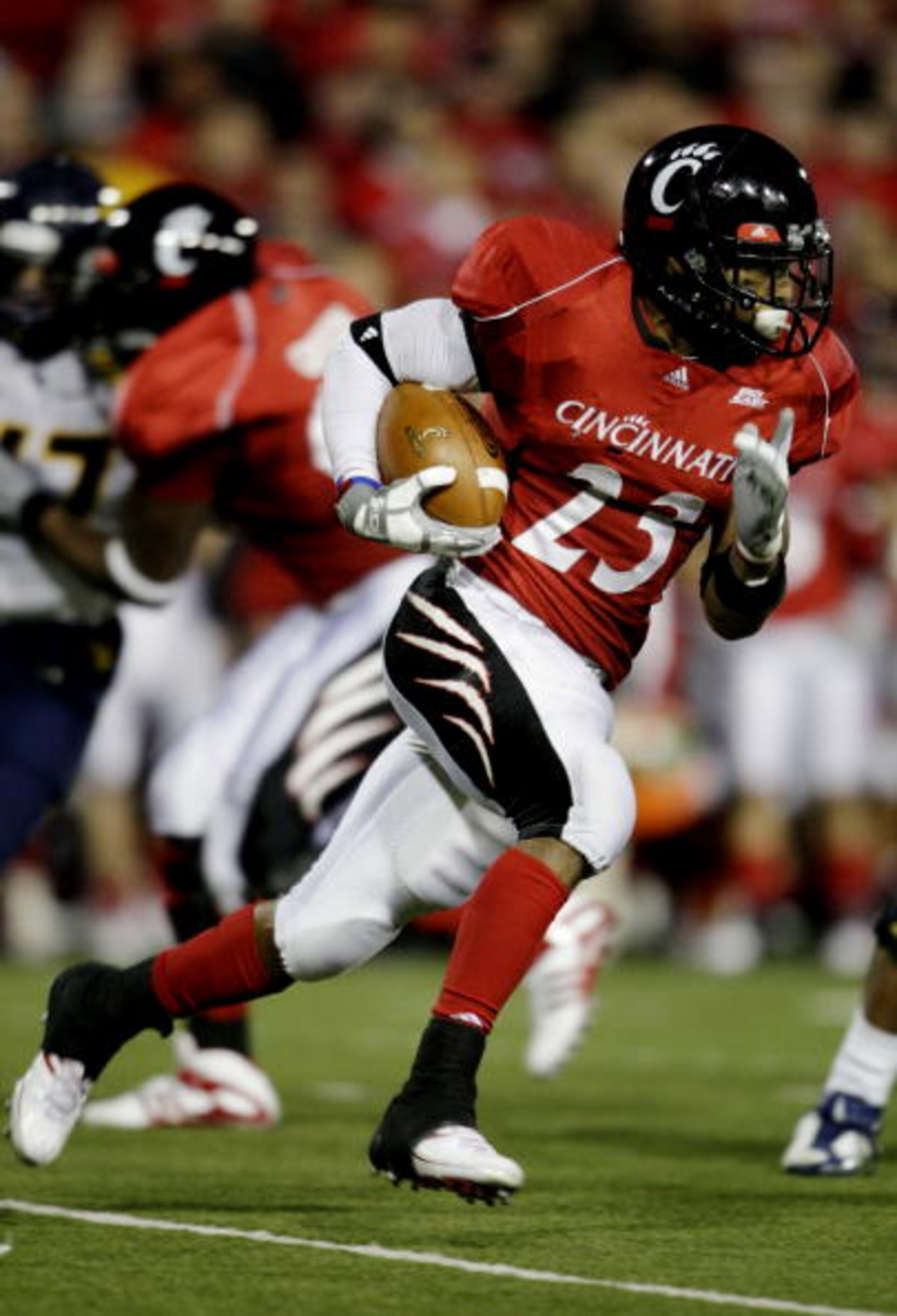 CINCINNATI - NOVEMBER 13:  Isaiah Pead #23 of the Cincinnati Bearcats carries the ball against the West Virginia Mountaineers in the fourth quarter of the game at Nippert Stadium on November 13, 2009 in Cincinnati, Ohio.  (Photo by Andy Lyons/Getty Images