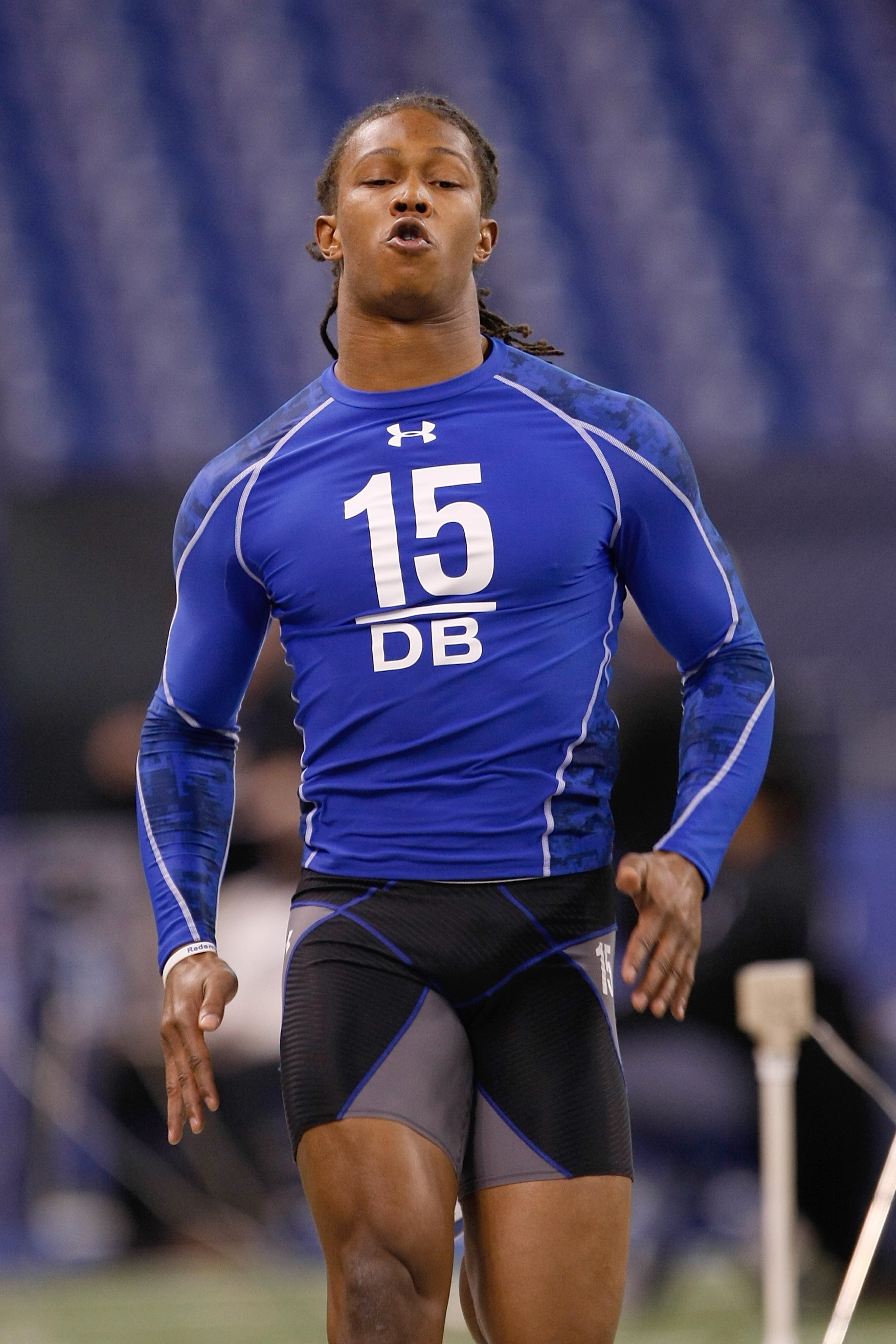 INDIANAPOLIS, IN - MARCH 2: Defensive back Chris Cook of Virginia runs the 40 yard dash during the NFL Scouting Combine presented by Under Armour at Lucas Oil Stadium on March 2, 2010 in Indianapolis, Indiana. (Photo by Scott Boehm/Getty Images)