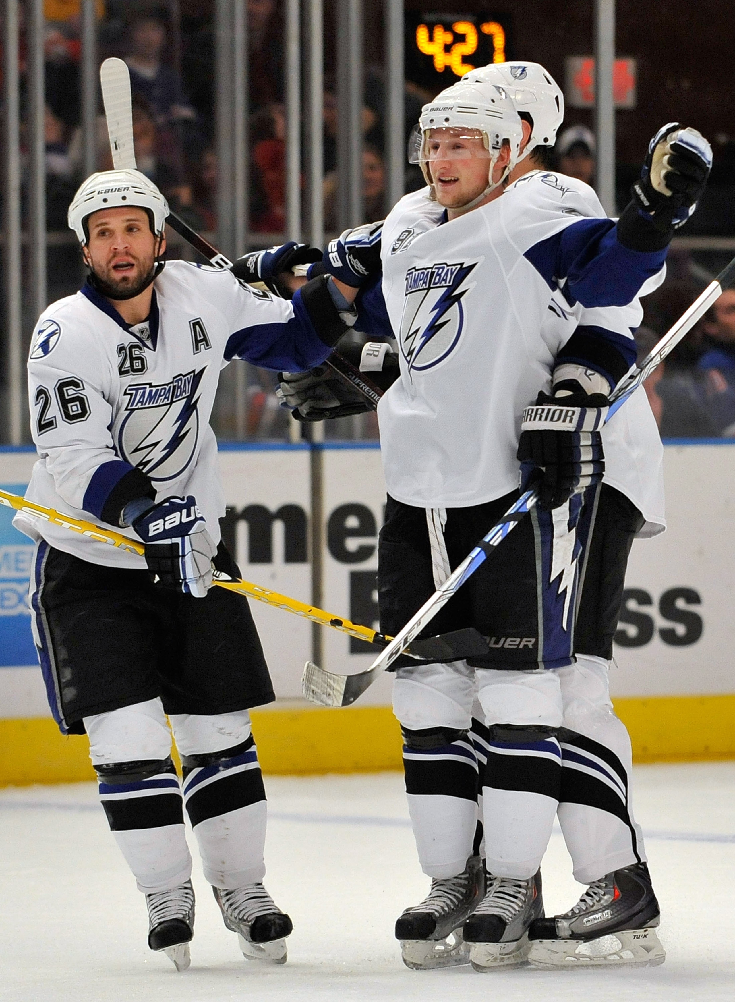 NEW YORK - FEBRUARY 14:  Martin St Louis #26 of the Tampa Bay Lightning celebrates a goal scored by his teammate Steven Stamkos (91) with Stamkos for his first goal of the first period of an NHL game against the New York Rangers at Madison Square Garden o