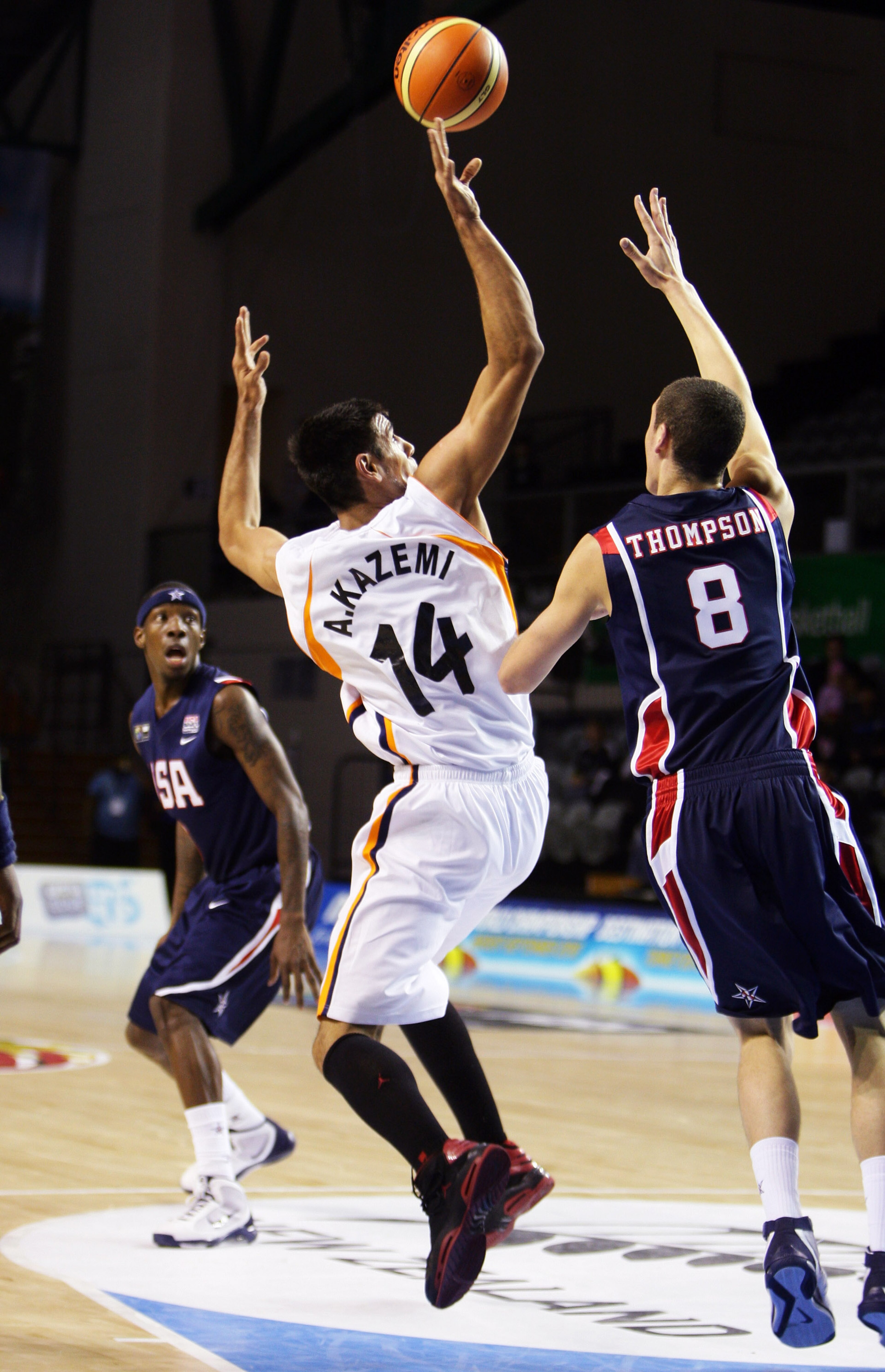 AUCKLAND, NEW ZEALAND - JULY 02: Arsalan Kazemi (C) of Iran shoots for the hoop past Klay Thompson (R) of the USA during the FIBA Under 19 World Championship match between Iran and the United States of America at the North Shore Events Centre on July 2, 2 AUCKLAND, NEW ZEALAND - JULY 02: Arsalan Kazemi (C) of Iran shoots for the hoop past Klay Thompson (R) of the USA during the FIBA Under 19 World Championship match between Iran and the United States of America at the North Shore Events Centre on July 2, 2