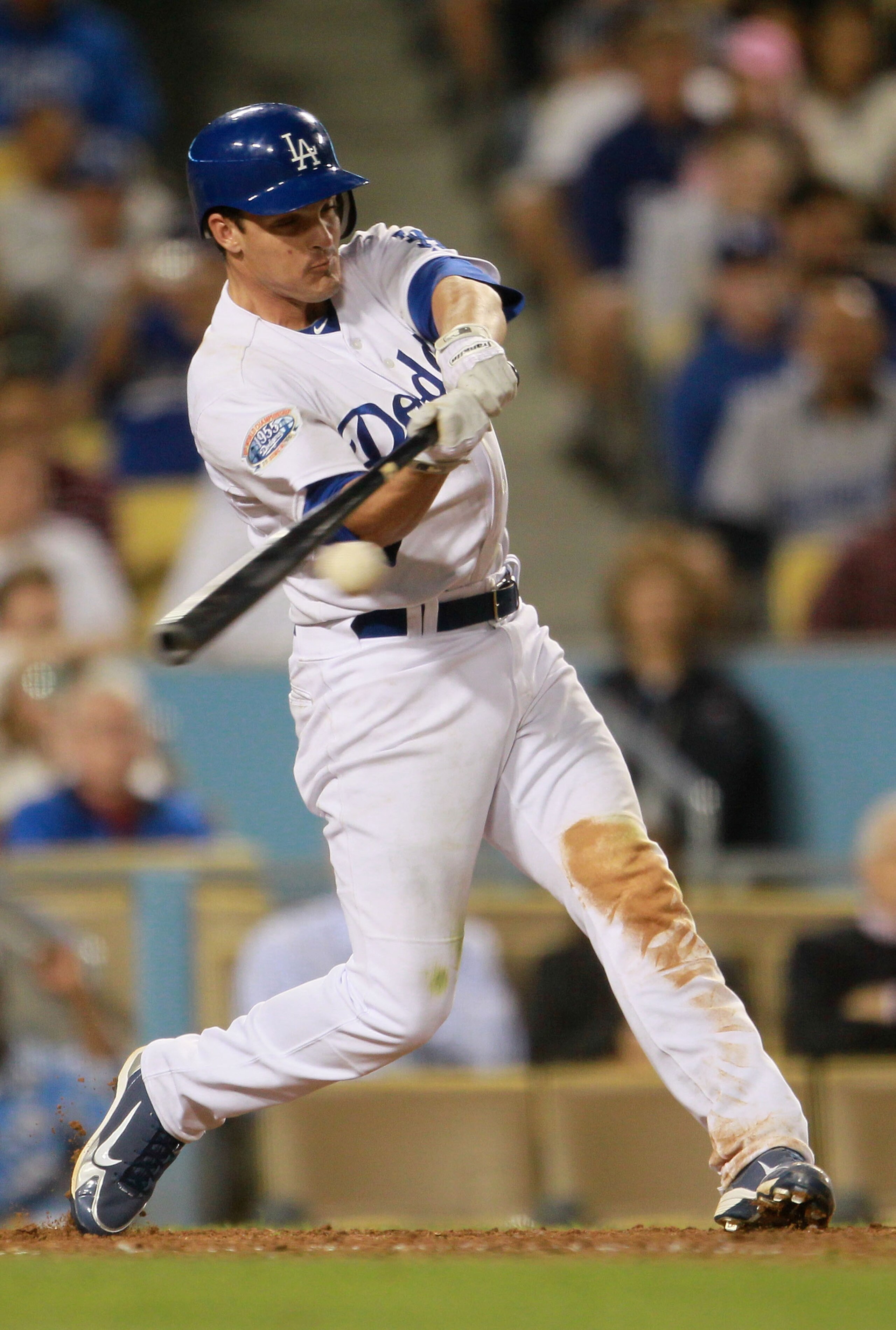 LOS ANGELES, CA - AUGUST 04:  Ryan Theriot #13 of the Los Angeles Dodgers hits a double scoring two runs in the eighth inning against the San Diego Padres at Dodger Stadium on August 4, 2010 in Los Angeles, California. The Dodgers defeated the Padres 9-0.