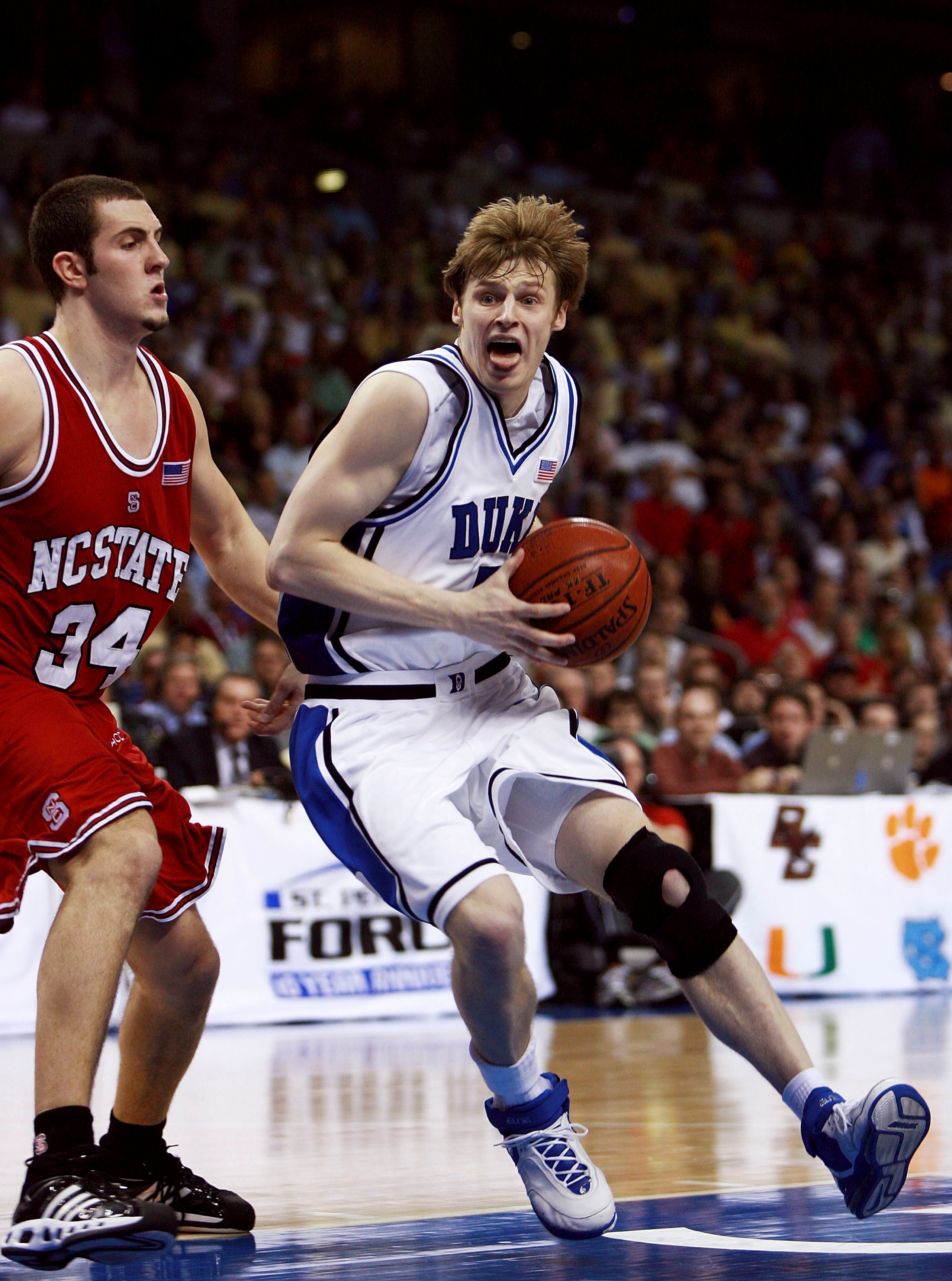 TAMPA, FL - MARCH 08:  Ben McCauley #34 of the North Carolina State Wolfpack can't stop Martynas Pocius #5 of the Duke Blue Devils in the opening round of the ACC Men's Basketball Tournament at the St. Pete Times Forum on March 8, 2007 in Tampa, Florida.