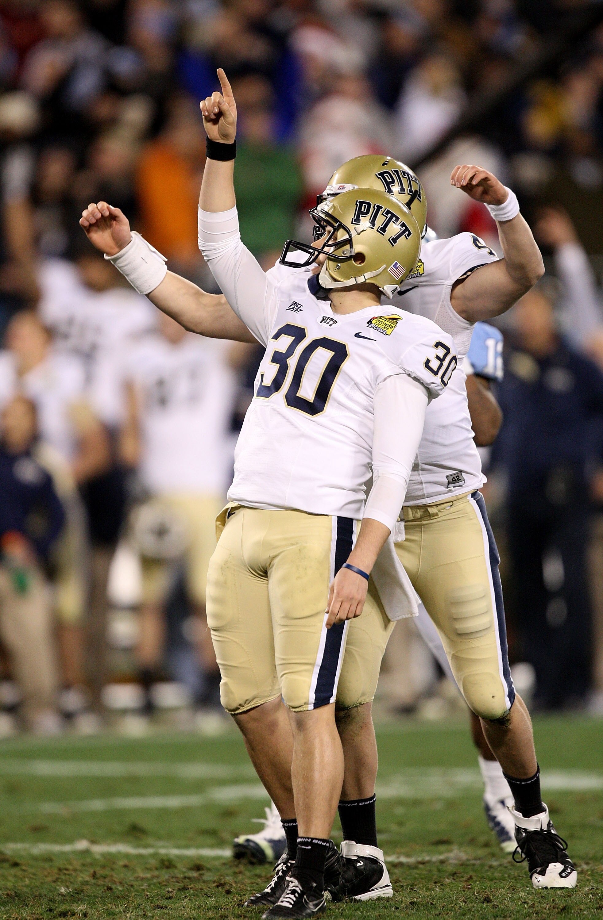 CHARLOTTE, NC - DECEMBER 26: Dan Hutchins #30 of the Pittsburgh Panthers celebrates with teammate Andrew Janocko #4 after making a game-winning field goal to defeat the North Carolina Tar Heels 19-17 during their game on December 26, 2009 in Charlotte, N CHARLOTTE, NC - DECEMBER 26: Dan Hutchins #30 of the Pittsburgh Panthers celebrates with teammate Andrew Janocko #4 after making a game-winning field goal to defeat the North Carolina Tar Heels 19-17 during their game on December 26, 2009 in Charlotte, N