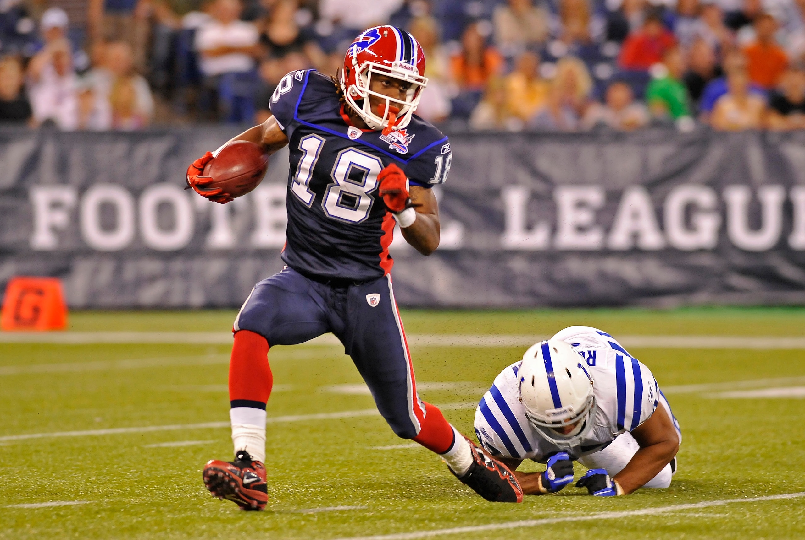 TORONTO, CANADA - AUGUST 19: Naaman Roosevelt #18 of the Buffalo Bills avoids the the tackle of Gijon Robinson #47 of the Indianapolis Colts during game action August 19, 2010 at the Rogers Centre in Toronto, Ontario, Canada. (Photo by Brad White/Getty Im
