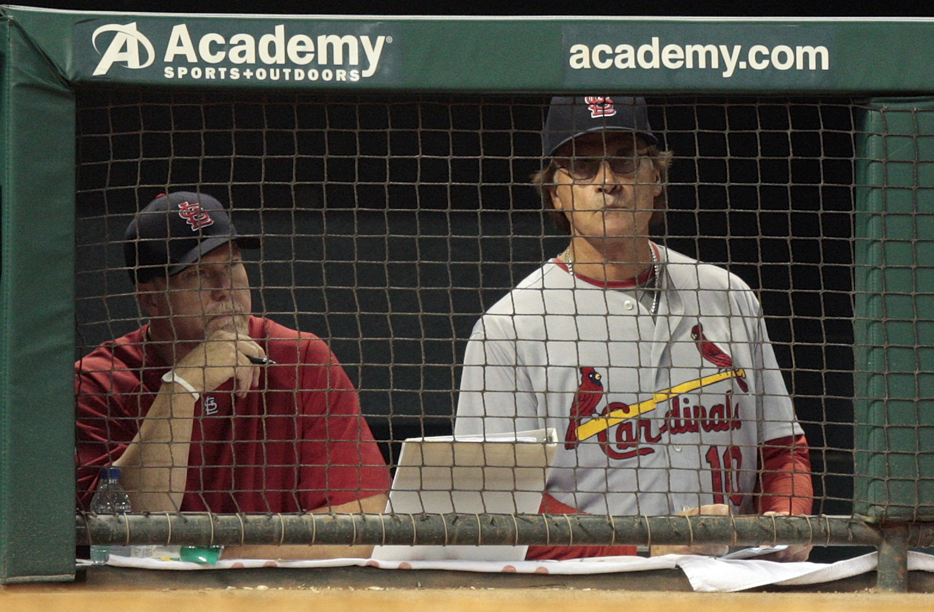 HOUSTON - AUGUST 31:  Manager Tony La Russa (R) and hitting coach Mark McGwire of the St. Louis Cardinals look on from the dugout in the ninth inning at Minute Maid Park on August 31, 2010 in Houston, Texas.  (Photo by Bob Levey/Getty Images)