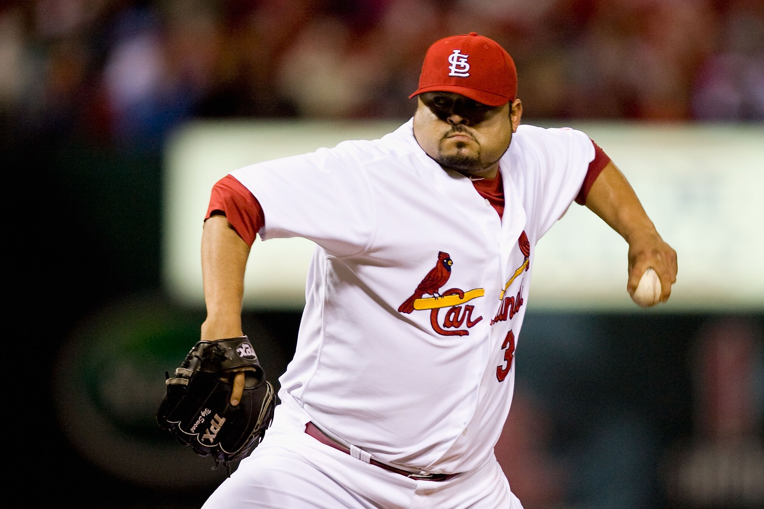 ST. LOUIS - APRIL 26: Relief pitcher Dennys Reyes #36 of the St. Louis Cardinals throws against the Atlanta Braves at Busch Stadium on April 26, 2010 in St. Louis, Missouri. (Photo by Dilip Vishwanat/Getty Images)