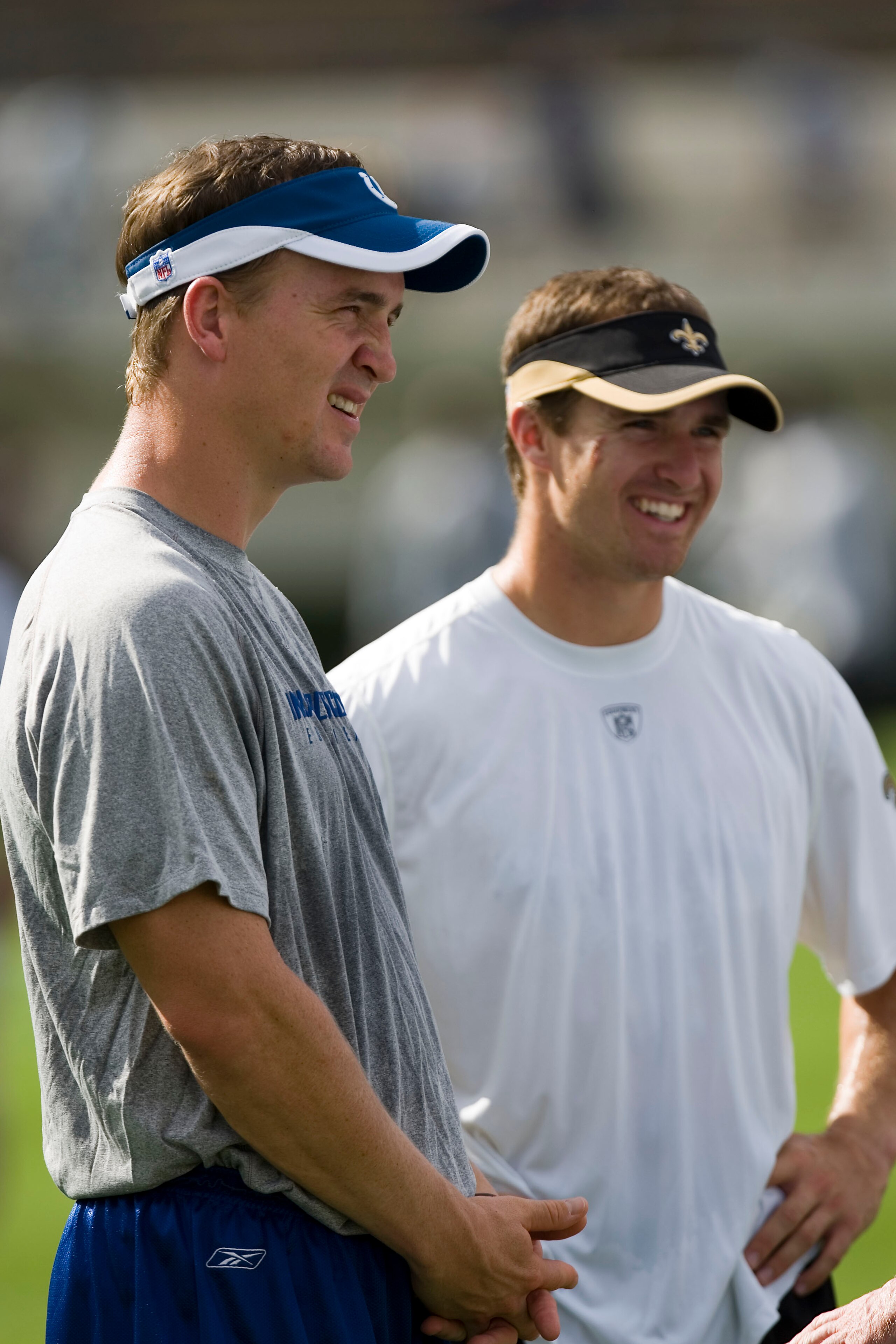 JACKSON, MS - AUGUST 26:  Quarterbacks Peyton Manning of the Indianapolis Colts and Drew Brees of the New Orleans Saints share a laugh before the game on August 26, 2006 at Veterans Memorial Stadium in Jackson, Mississippi.  The Colts won 27-14.    (Photo
