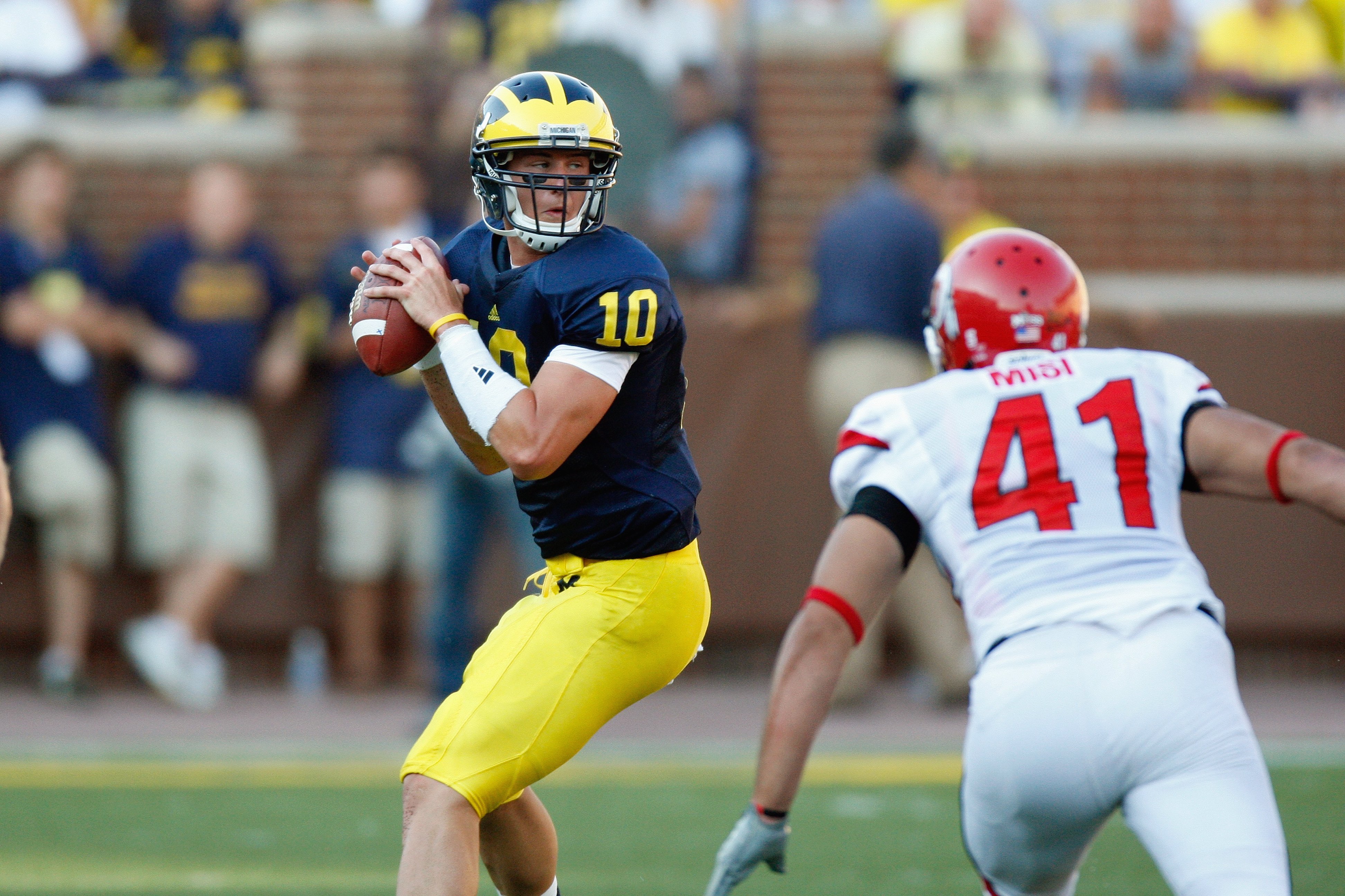 ANN ARBOR, MI - AUGUST 30:  Quarterback Steven Threet #10 of the Michigan Wolverines looks to pass the ball against Koa Misi #41 of the Utah Utes on August 30, 2008 at Michigan Stadium in Ann Arbor, Michigan. (Photo by: Gregory Shamus/Getty Images)