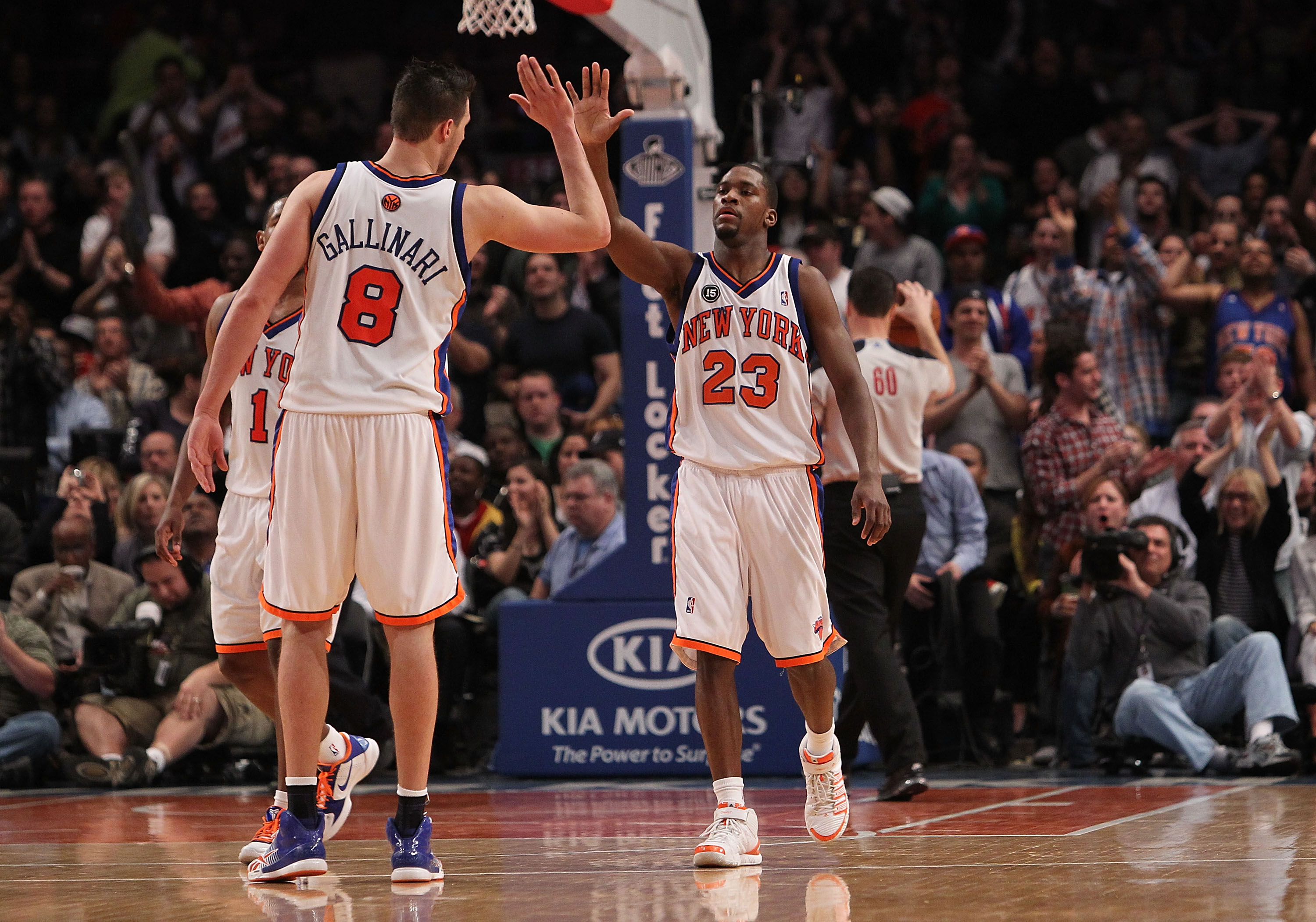 NEW YORK - MARCH 19: Toney Douglas #23 of the New York Knicks celebrates a basket with teammate Danilo Gallinari #8 against the Philadelphia 76ers at Madison Square Garden on March 19, 2010 in New York City. NOTE TO USER: User expressly acknowledges and a