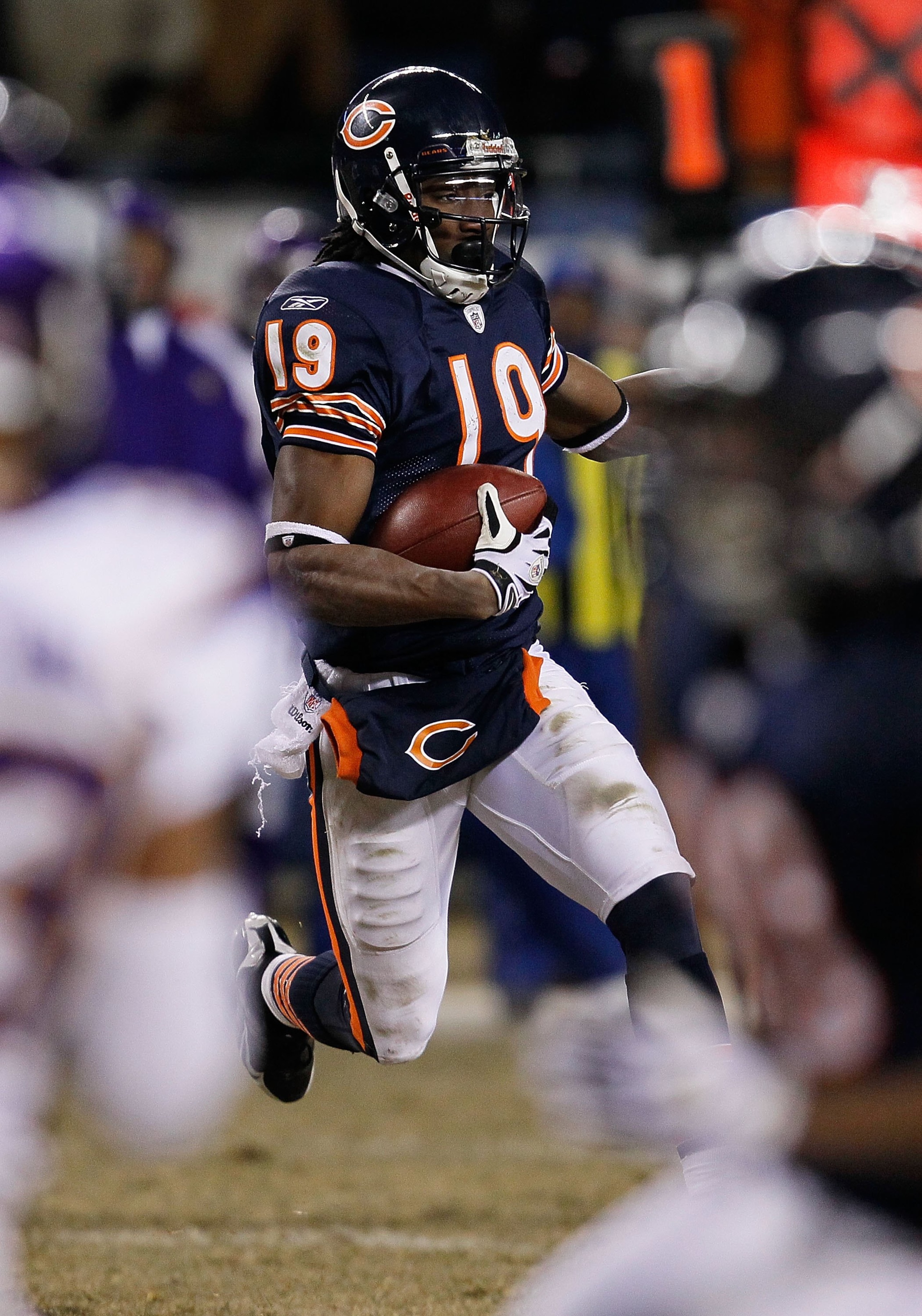 CHICAGO - DECEMBER 28: Devin Aromashodu #19 of the Chicago Bears runs for yardage after making a first down catch against the Minnesota Vikings at Soldier Field on December 28, 2009 in Chicago, Illinois. The Bears defeated the Vikings 36-30 in overtime.