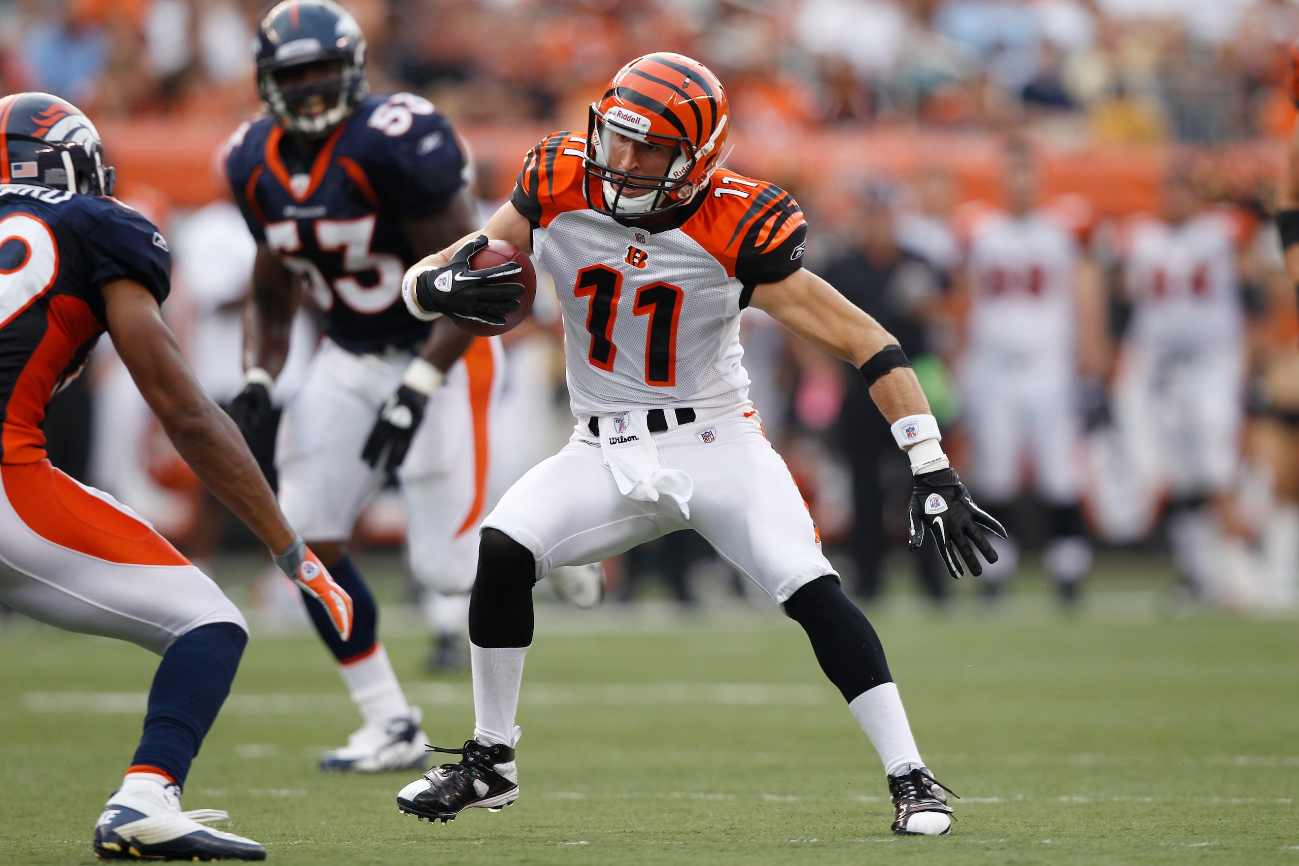 CINCINNATI, OH - AUGUST 15: Jordan Shipley #11 of the Cincinnati Bengals looks for room after catching a pass during the preseason game against the Denver Broncos at Paul Brown Stadium on August 15, 2010 in Cincinnati, Ohio. The Bengals won 33-24. (Photo
